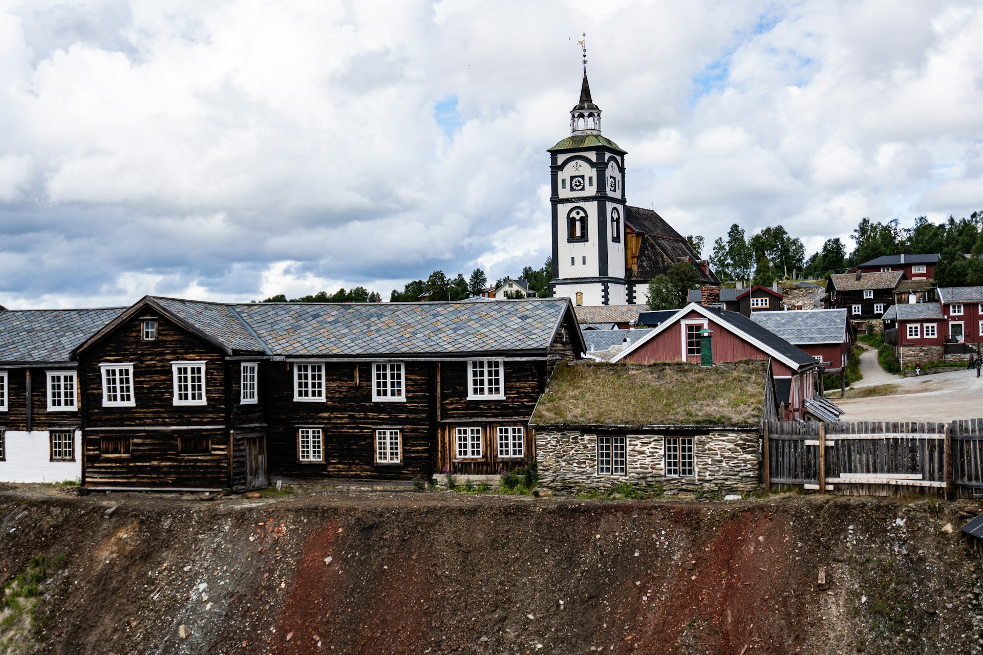 a large wooden building with a steeple on top of it