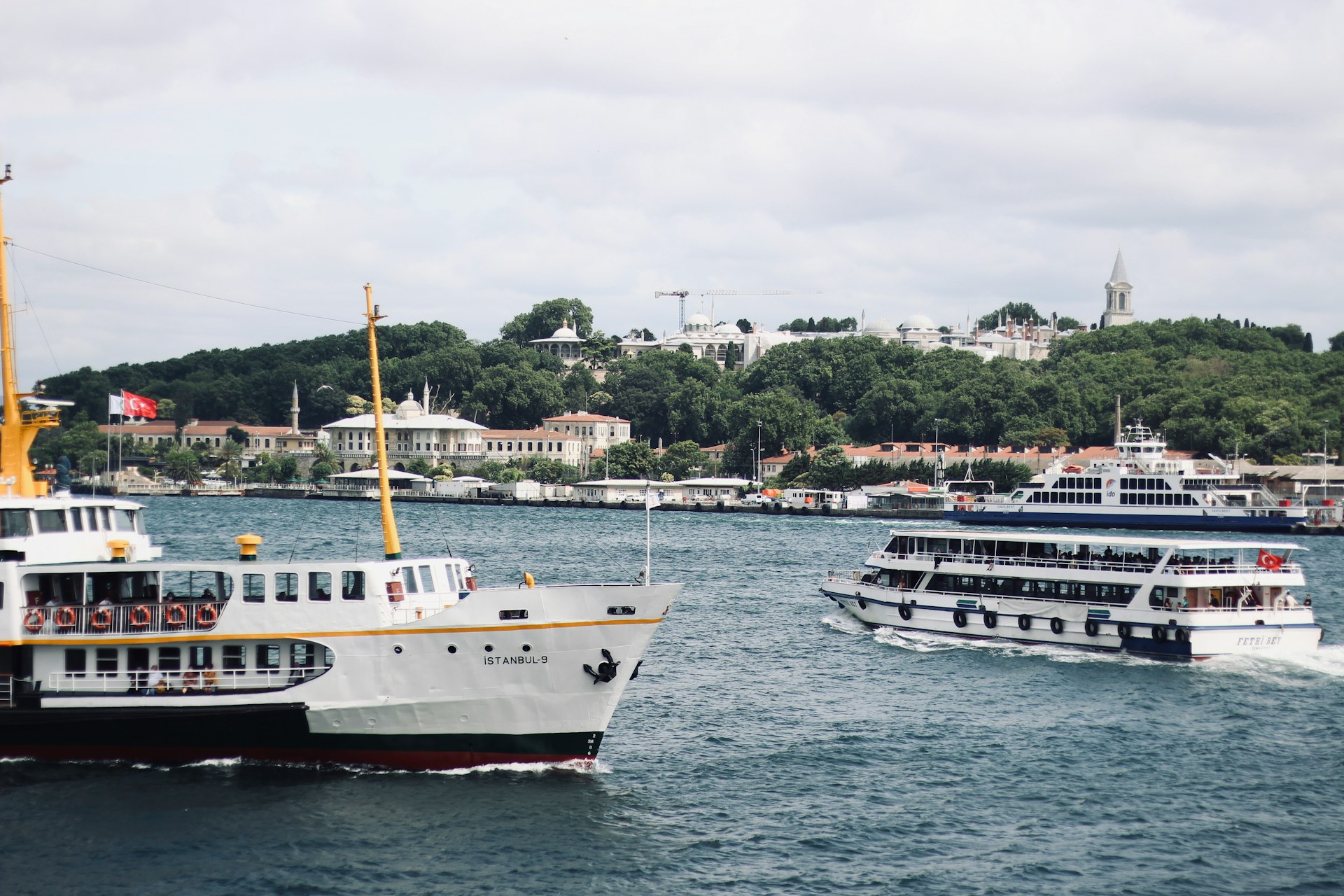 white and black boat on sea during daytime
