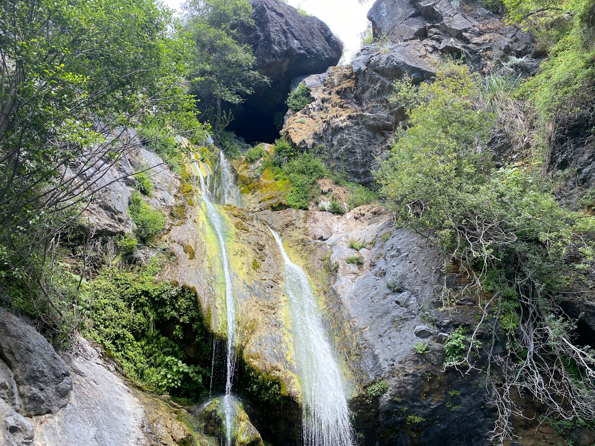 a waterfall in the middle of a rocky area