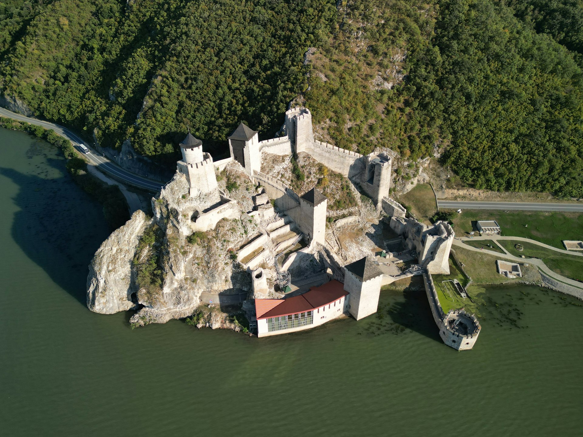 An aerial view of a castle in the middle of a lake