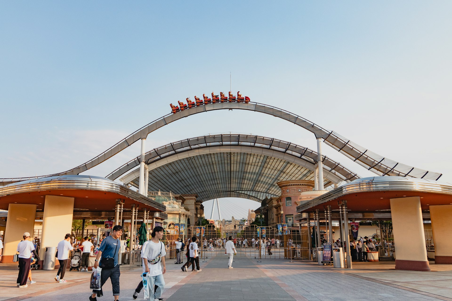 A group of people walking around a shopping center