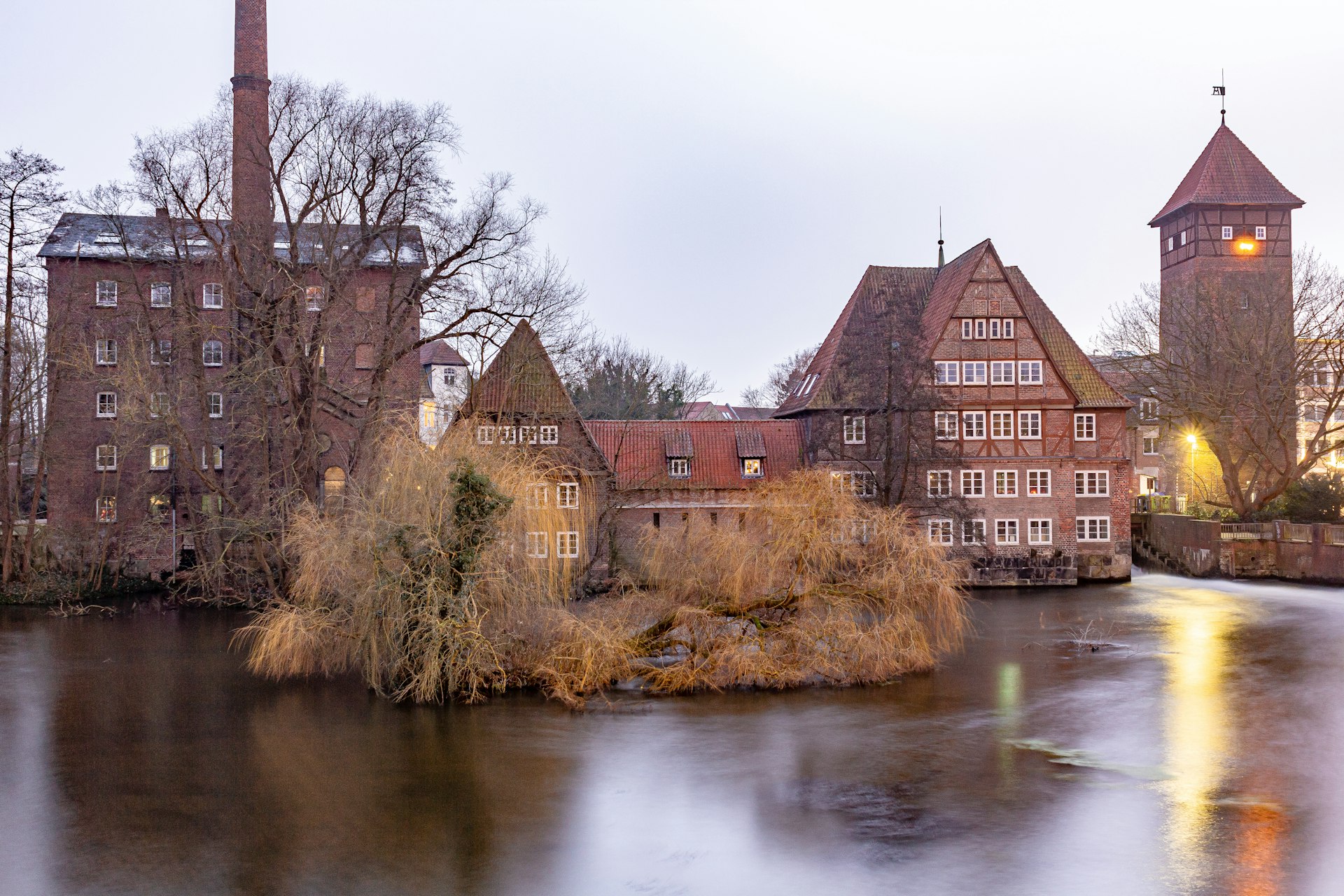 A large body of water with buildings in the background