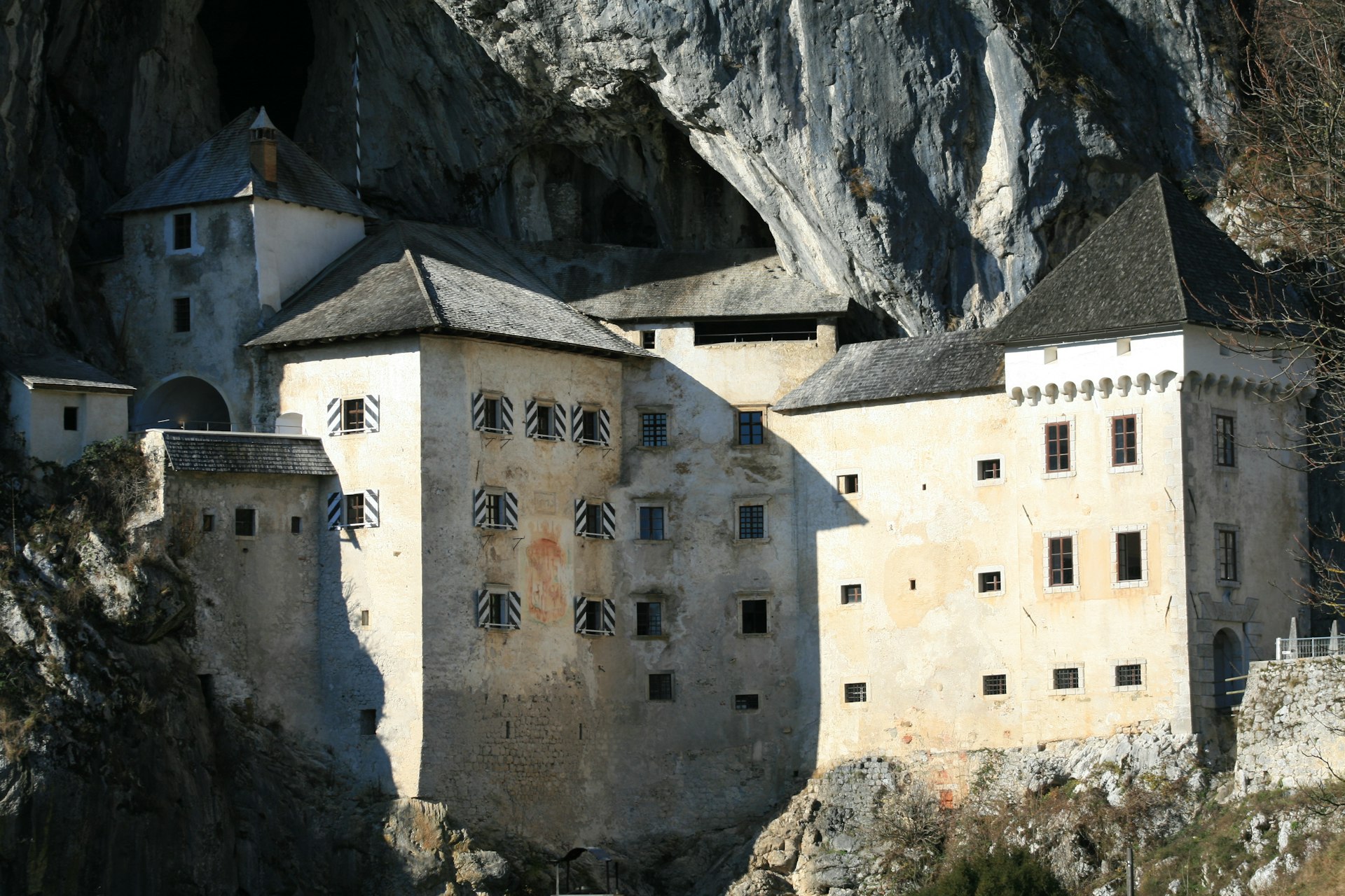 A castle built into the side of a mountain