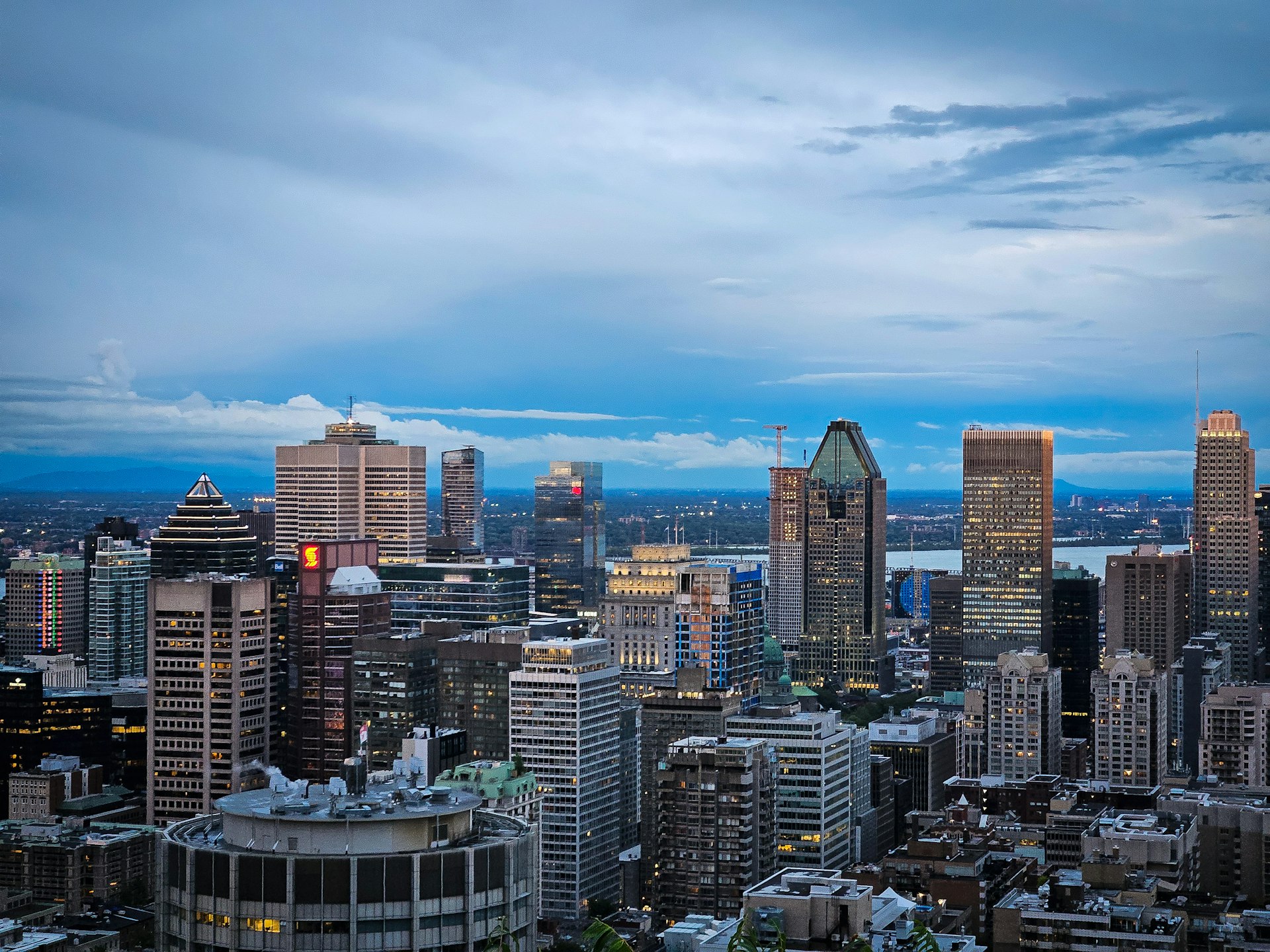 A view of a city at night from the top of a building