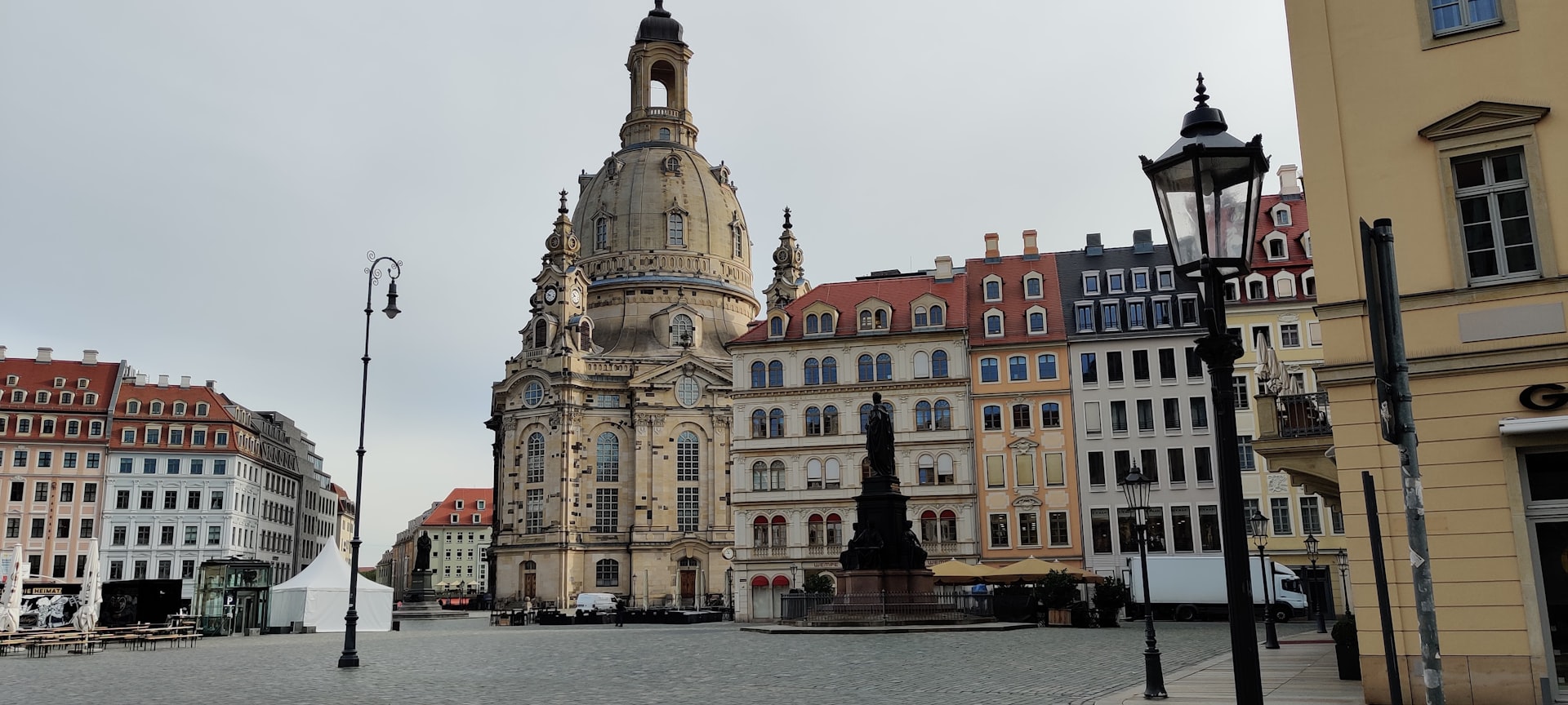 brown concrete building near body of water during daytime