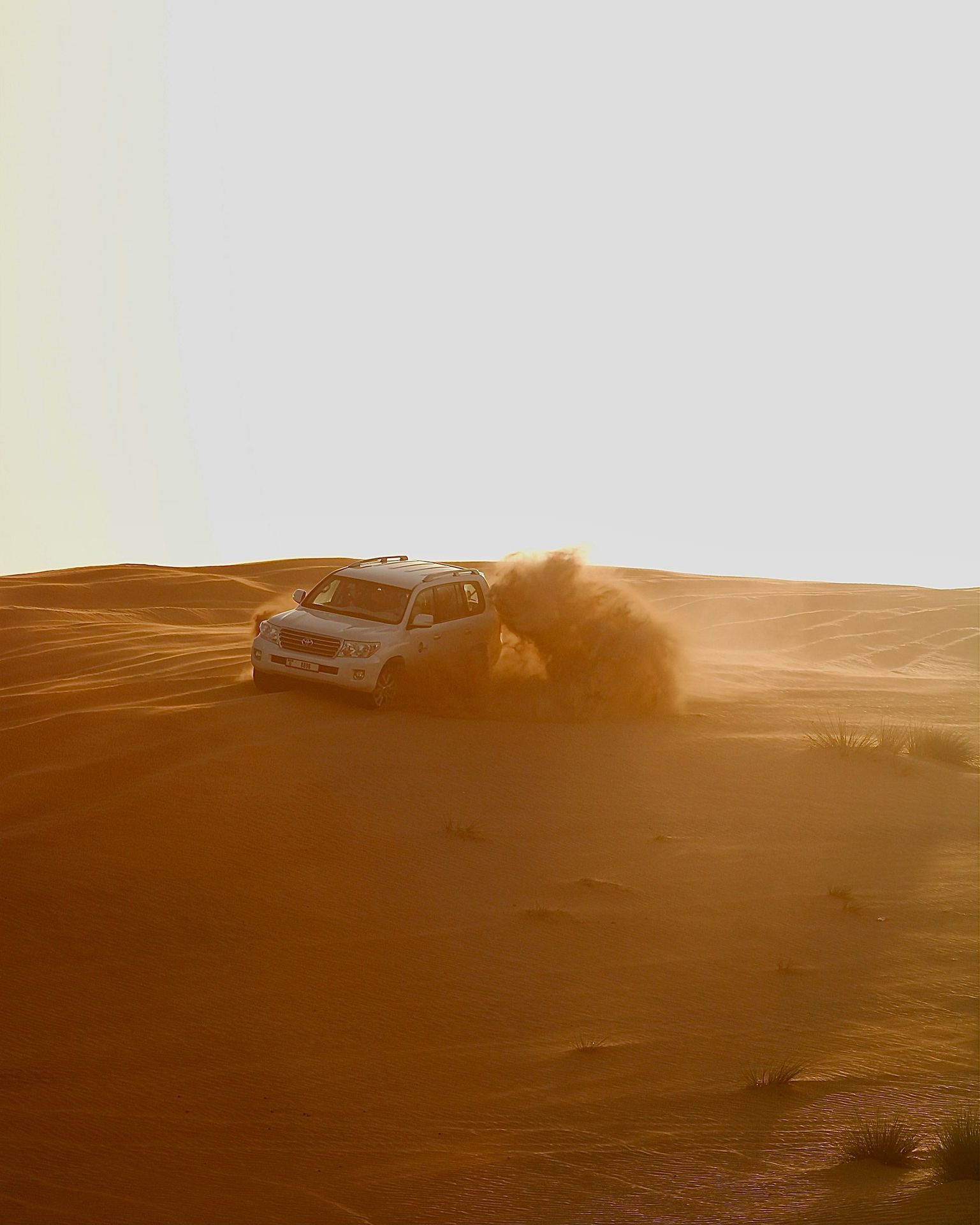 black car on desert during daytime
