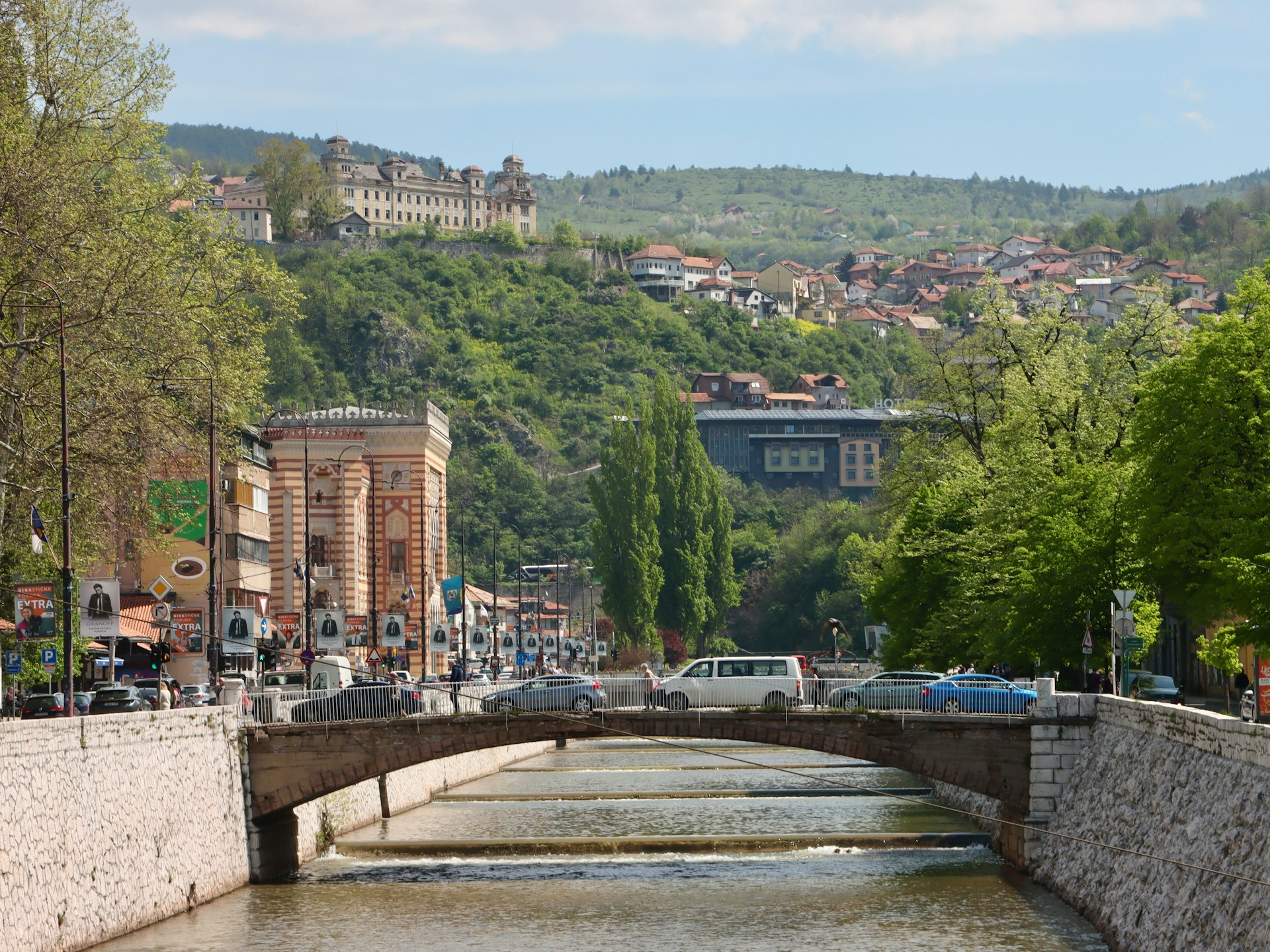 a river running through a city with a bridge over it