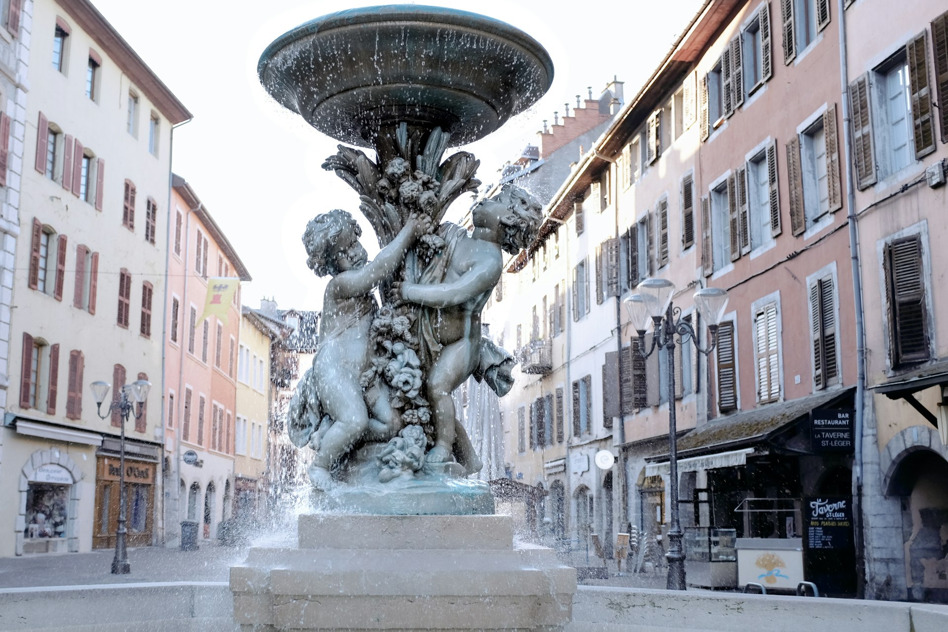 A fountain in the middle of a city square