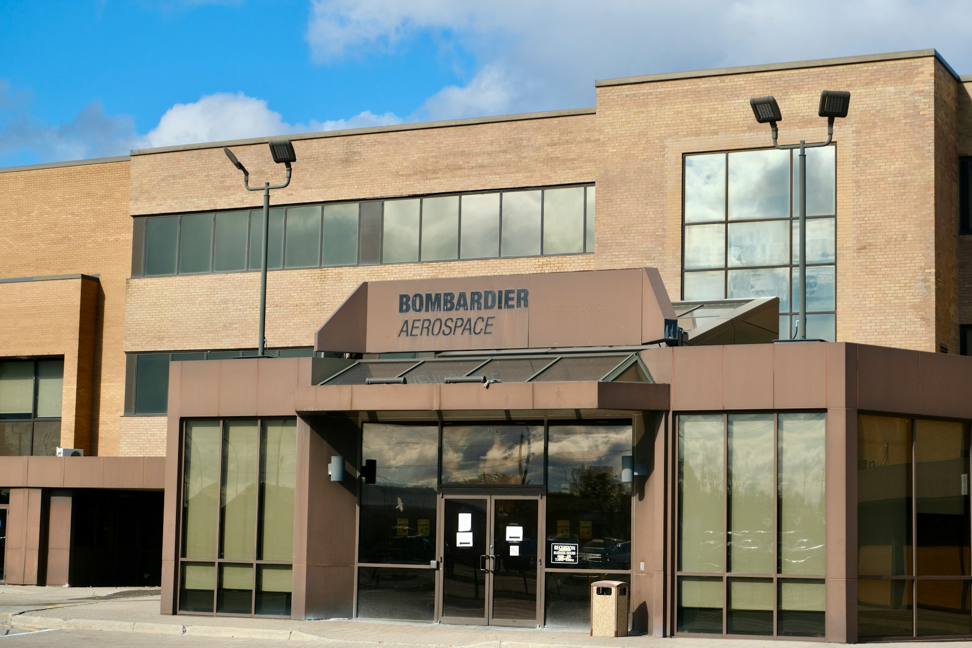 The front of a building with a sky background