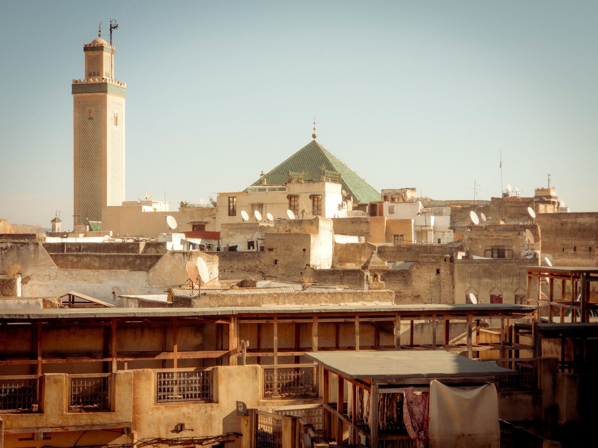 A view of a city from a rooftop of a building