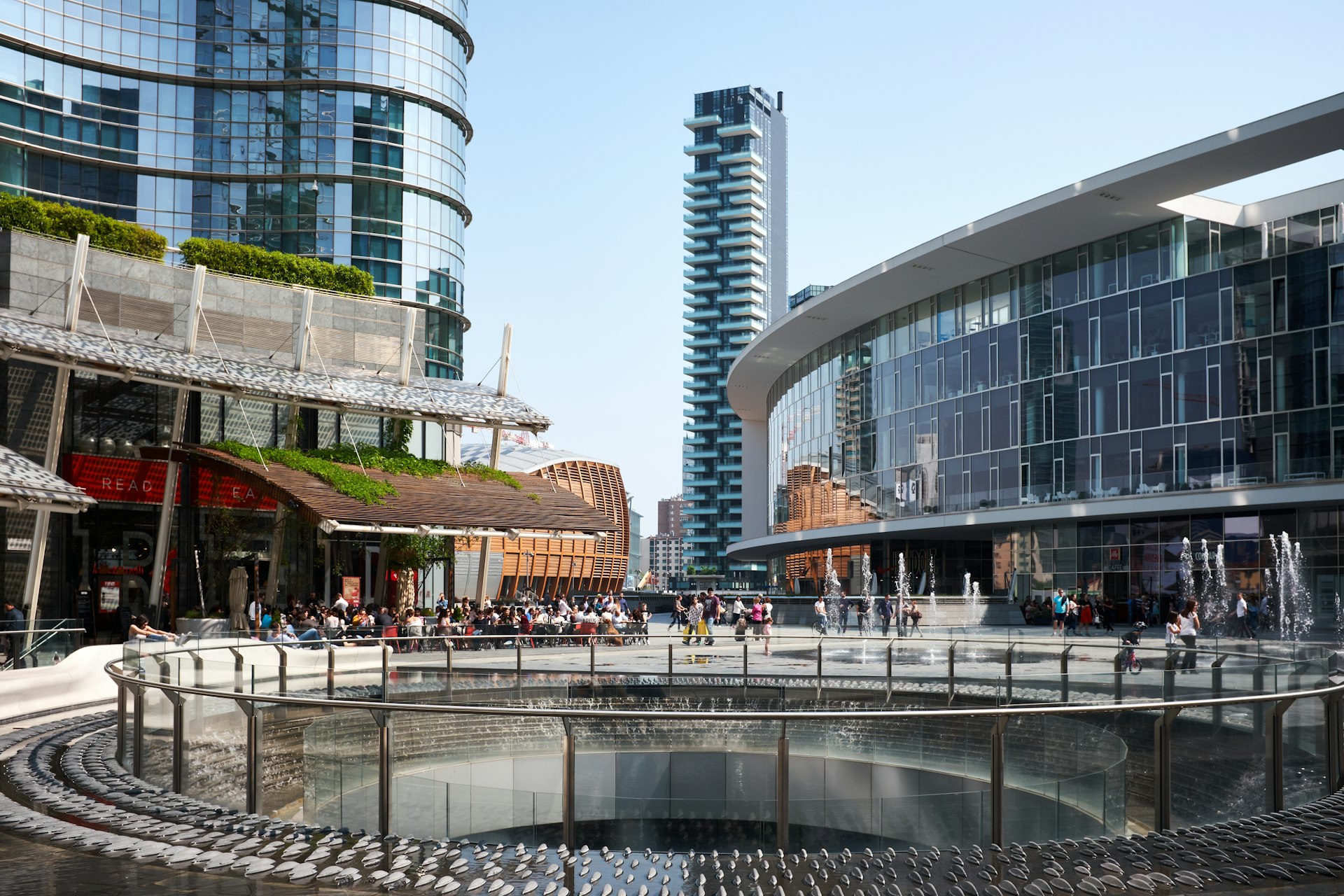people gathering near building and round railings at daytime