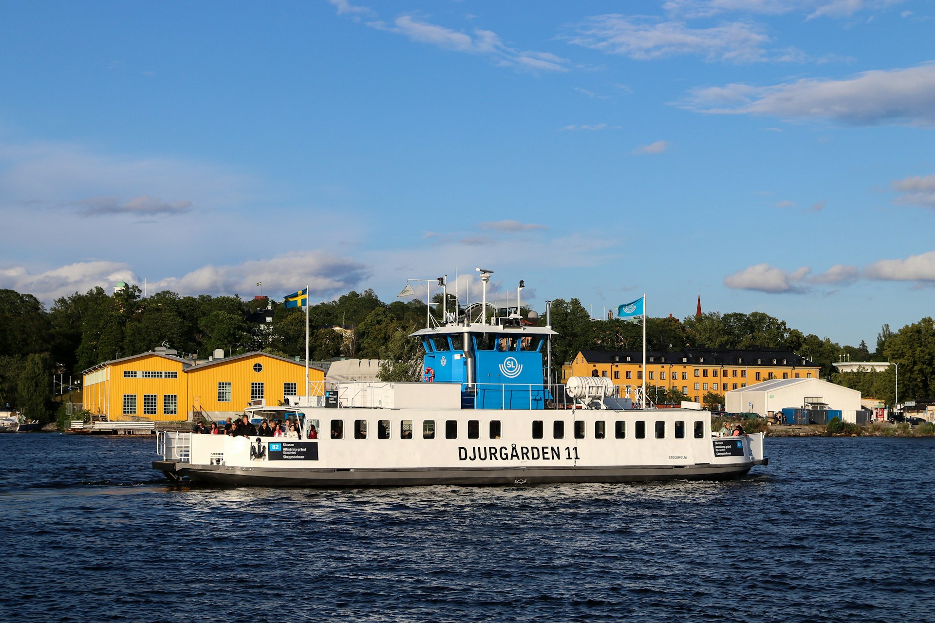A ferry sails on the water in stockholm.