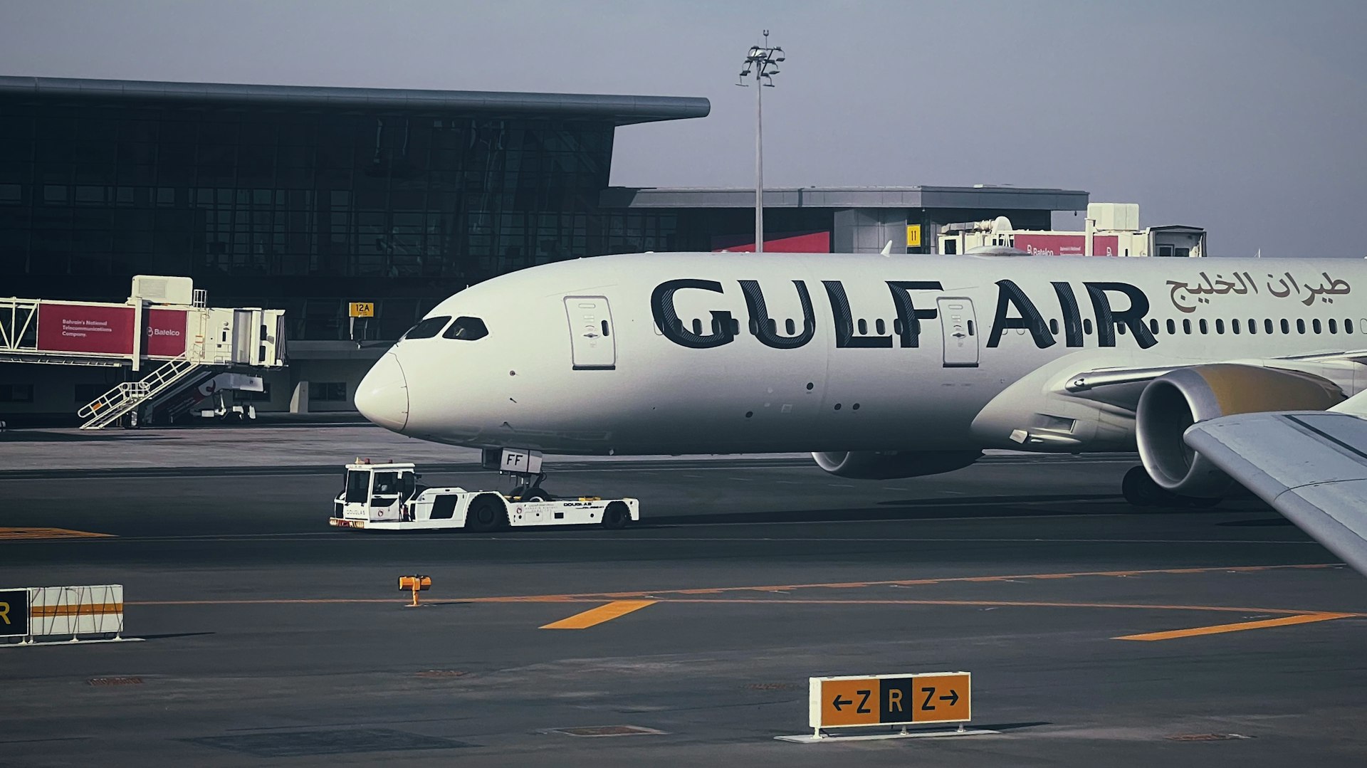 A large jetliner sitting on top of an airport tarmac