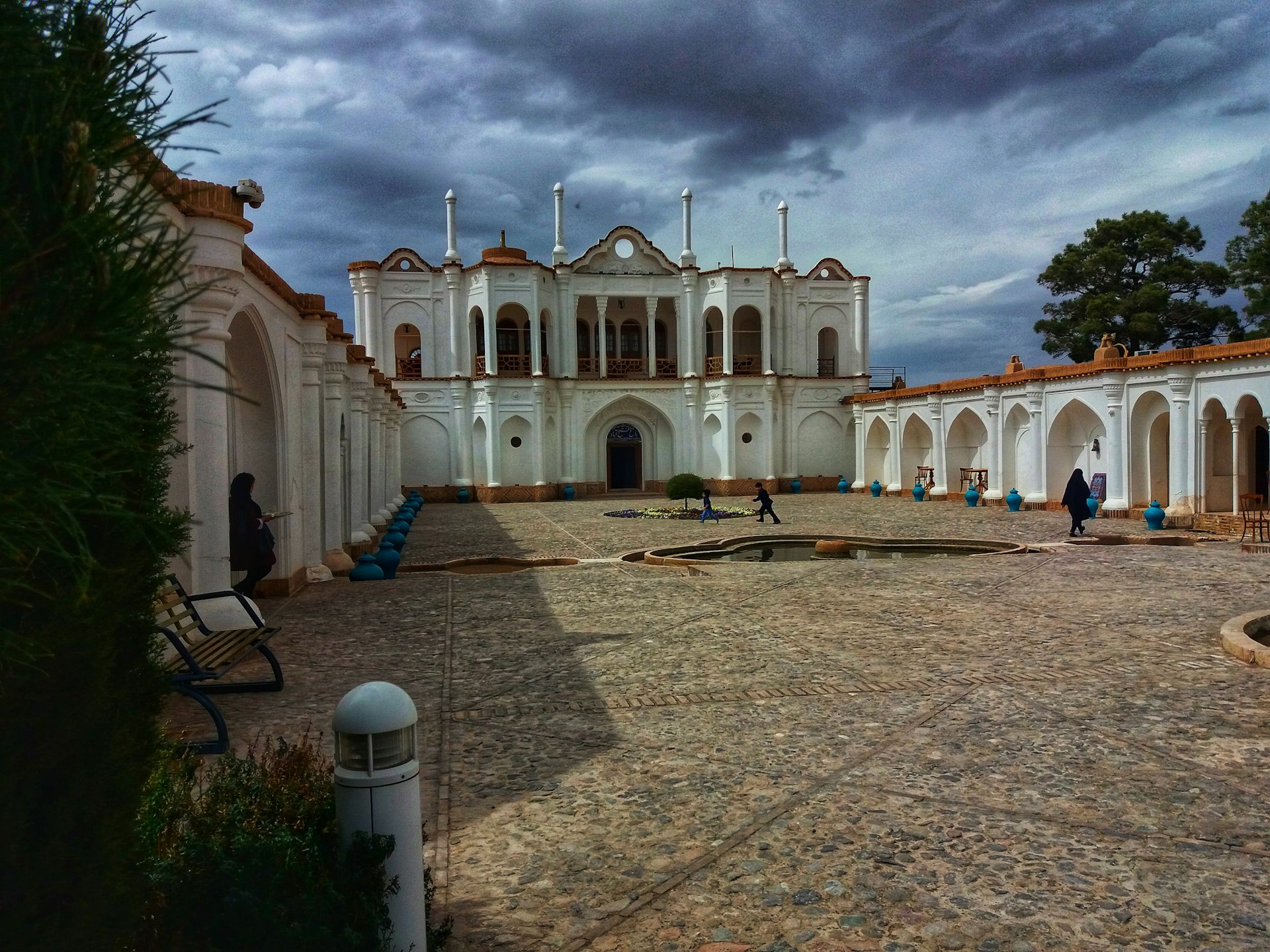 a large white building with a clock tower on top of it