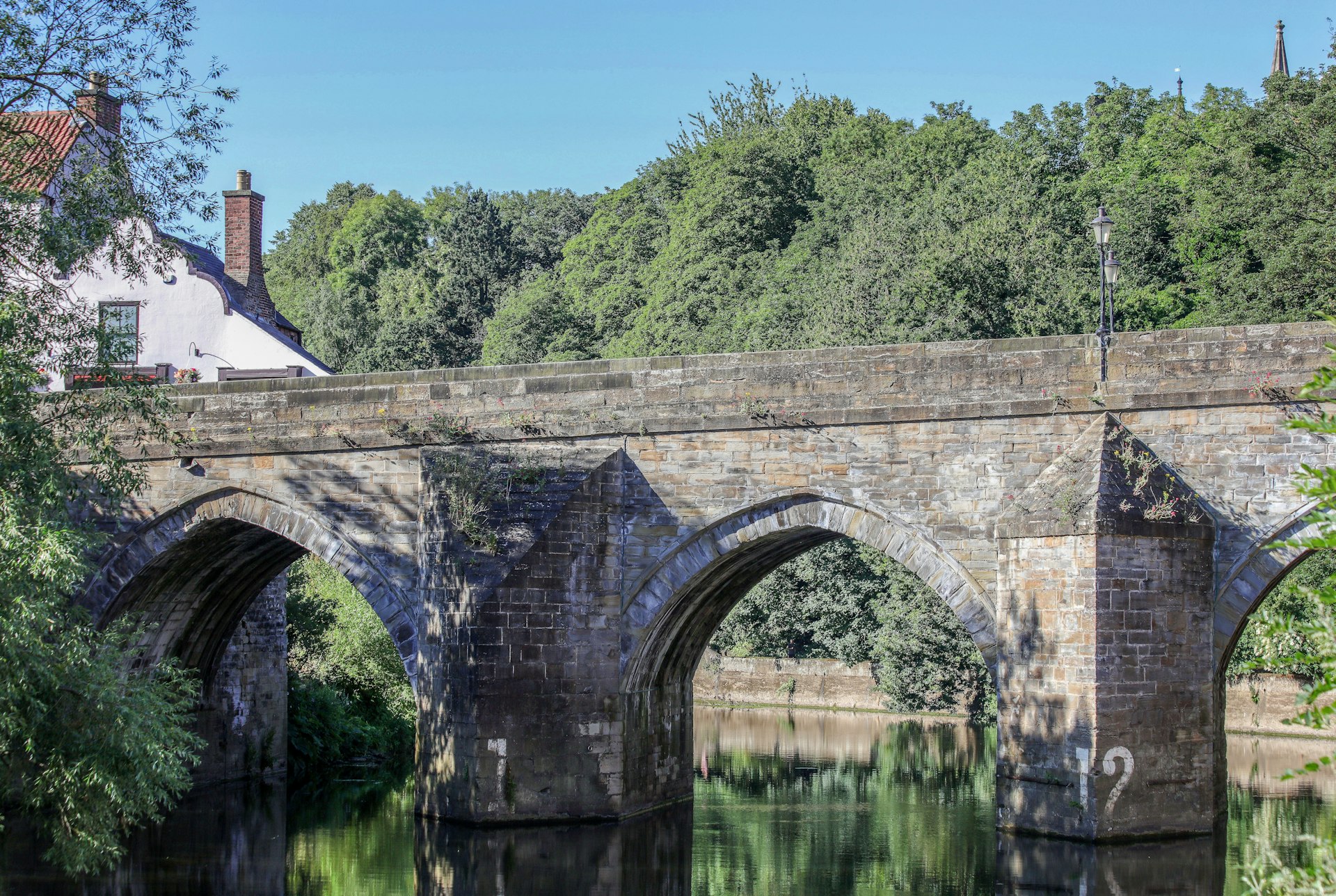 brown concrete bridge over river