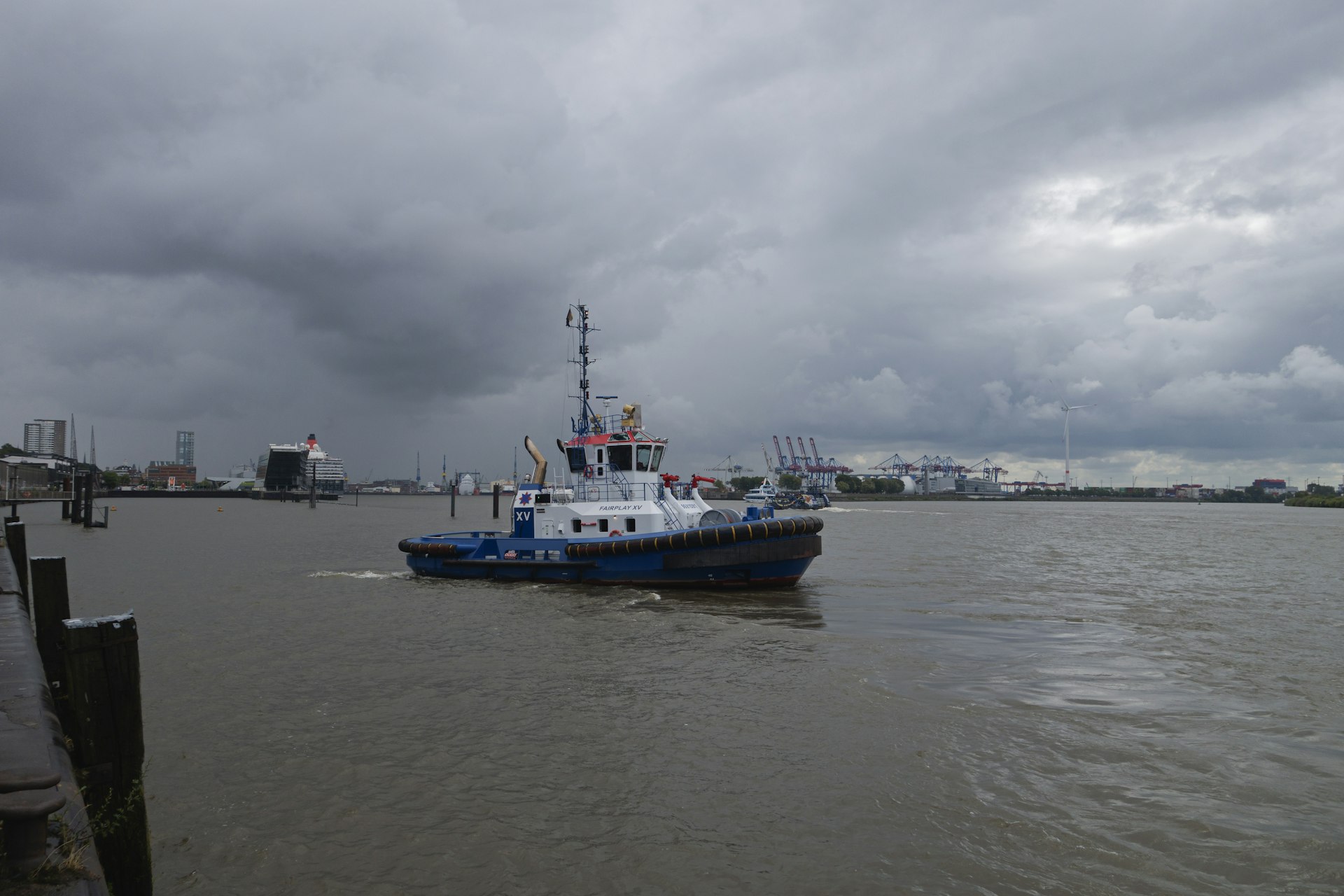 a blue and white boat in a body of water