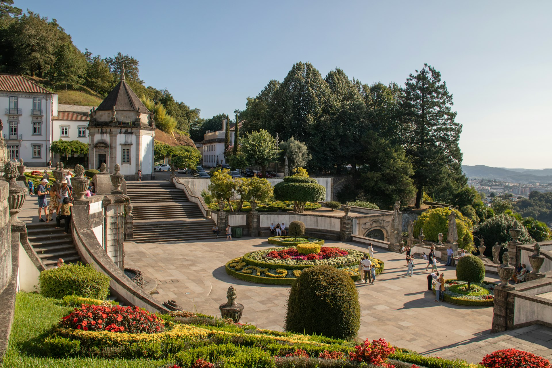A scenic view of a park with a lot of flowers