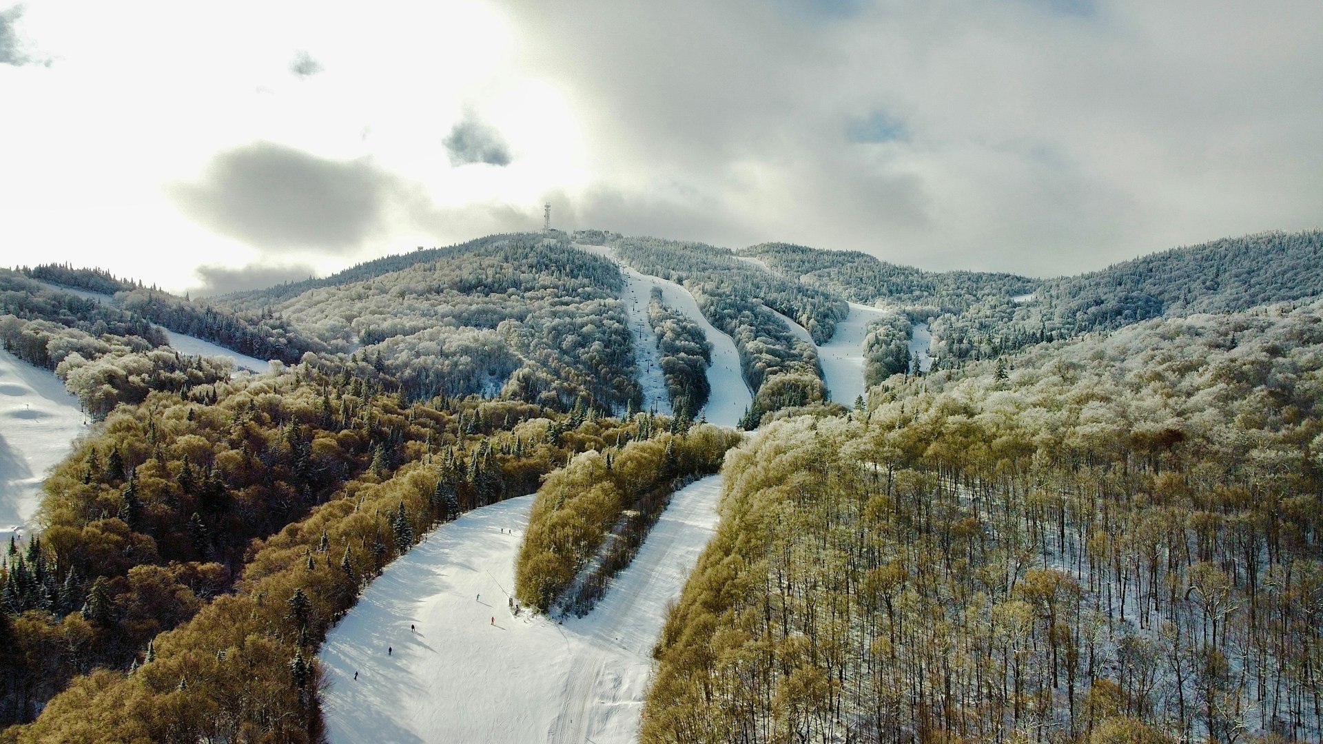 an aerial view of a snow covered mountain