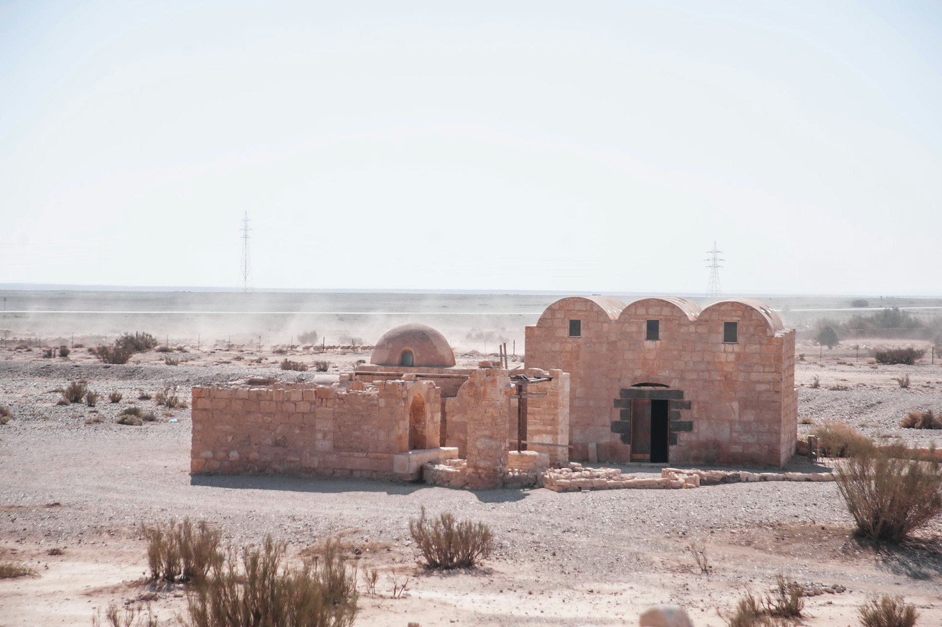 an old building in the middle of the desert