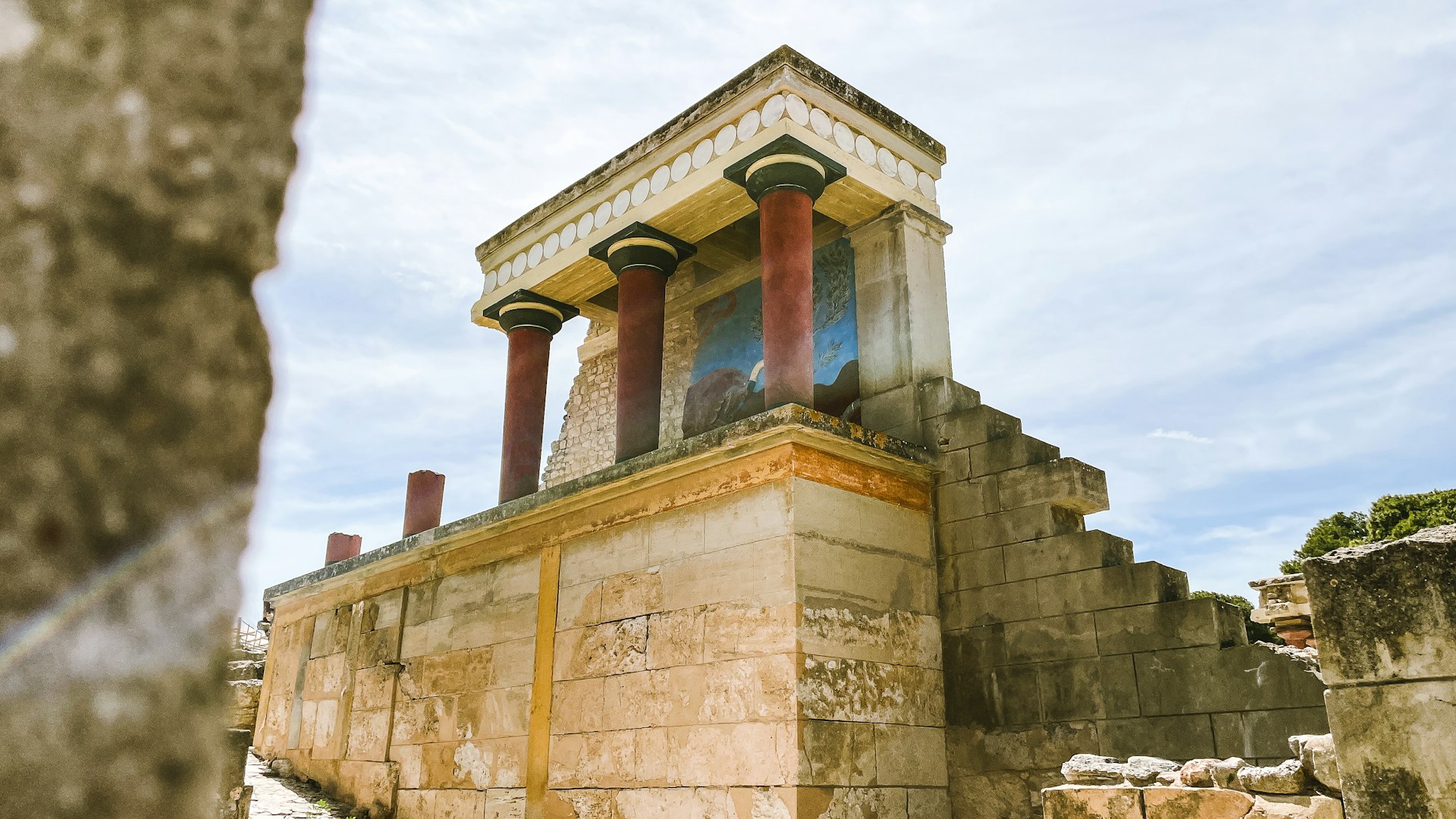 Ancient architecture with distinctive red columns.