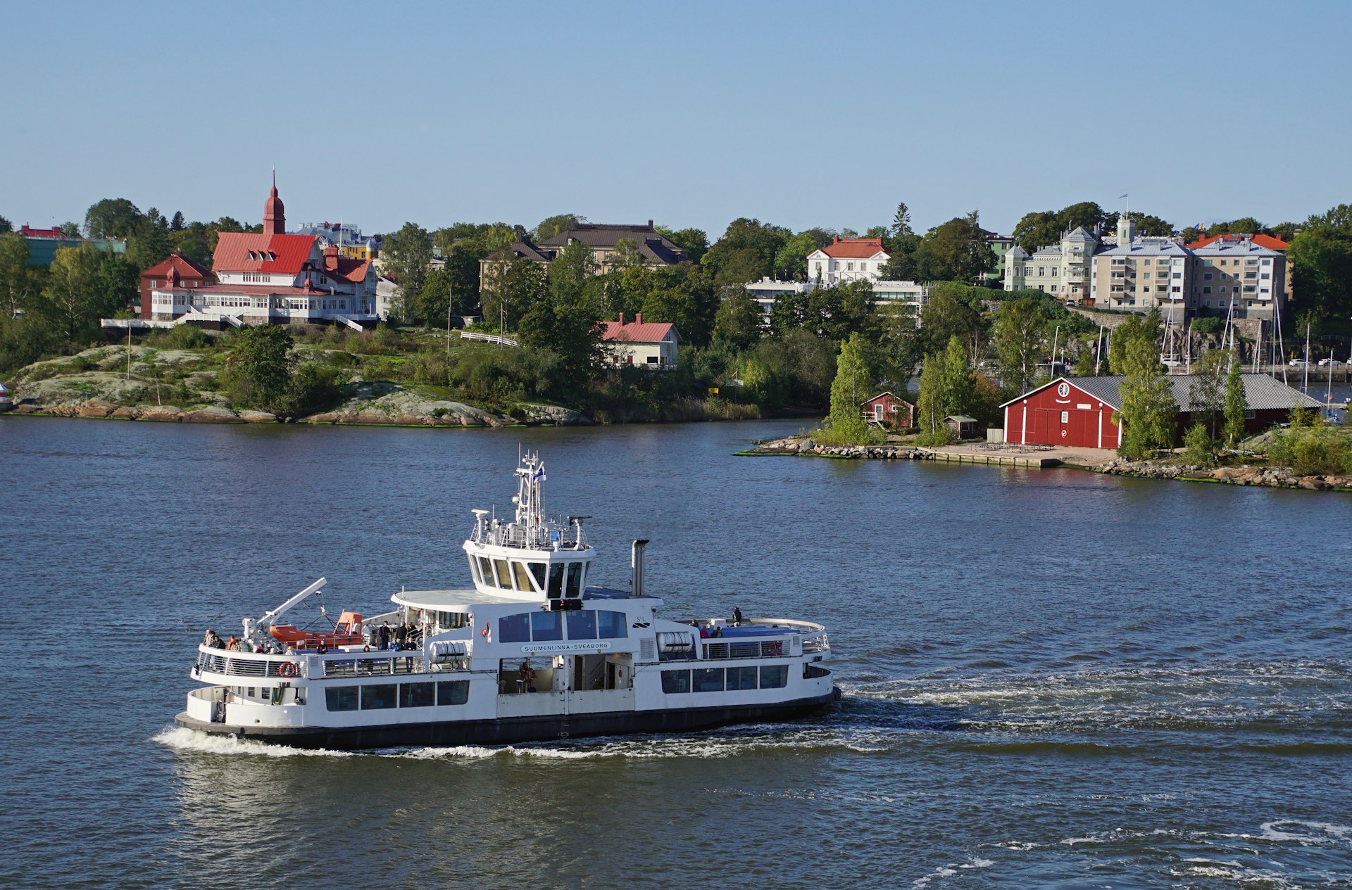 A large white boat on a large body of water