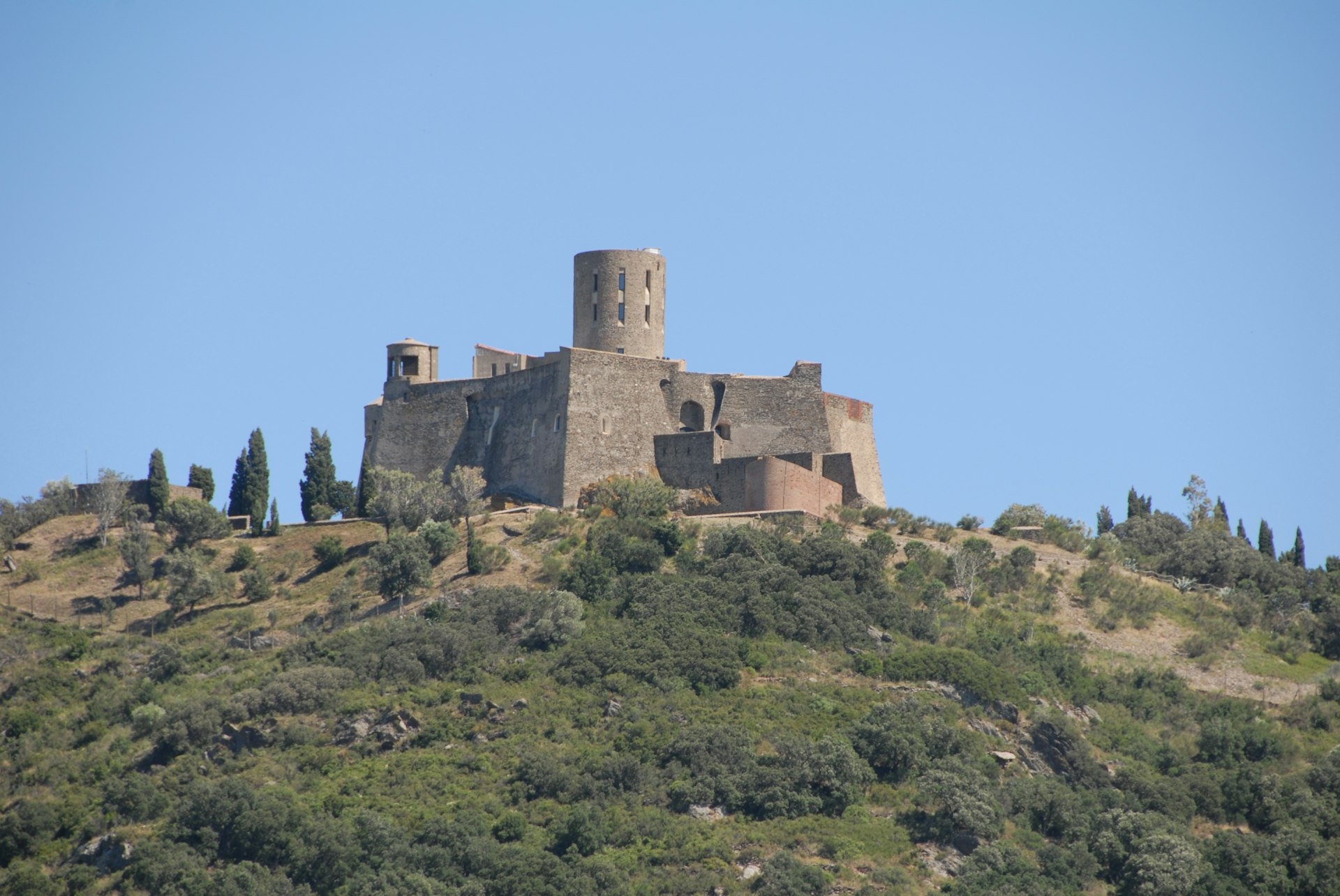 a stone castle on a hill