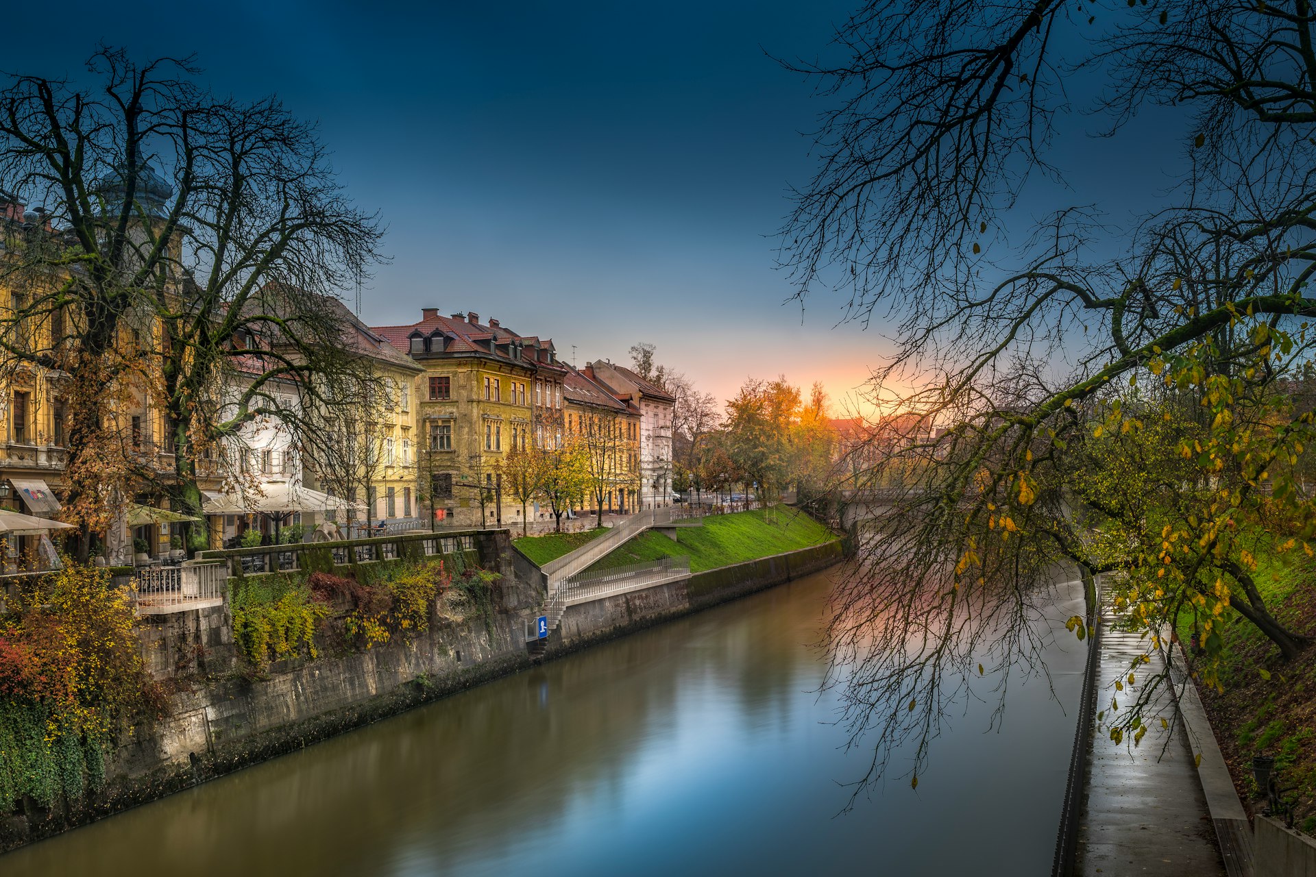 brown concrete building near river during daytime