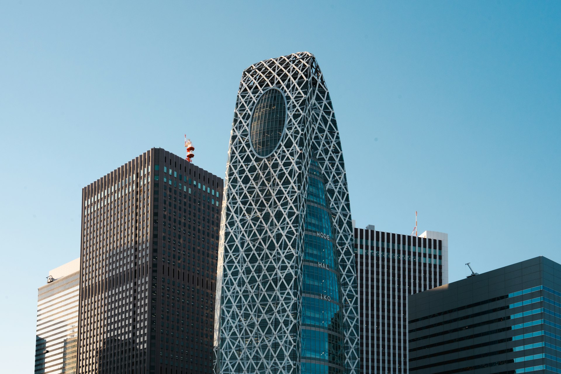 a very tall building with a clock on it's side