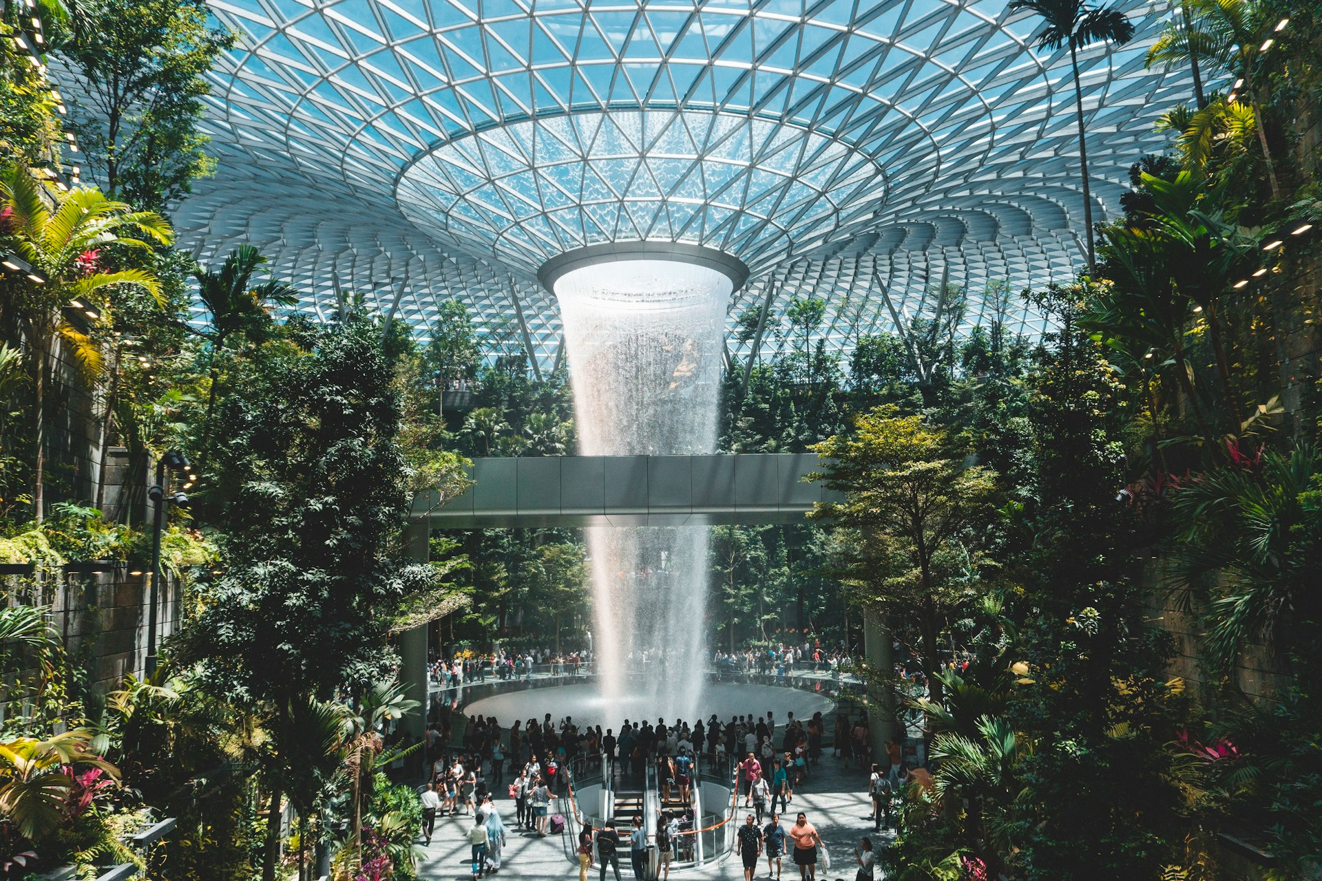 people standing beside gray concrete structure during daytime