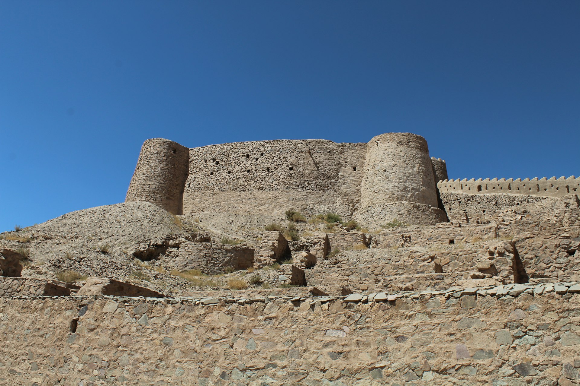 a large stone castle sitting on top of a hill