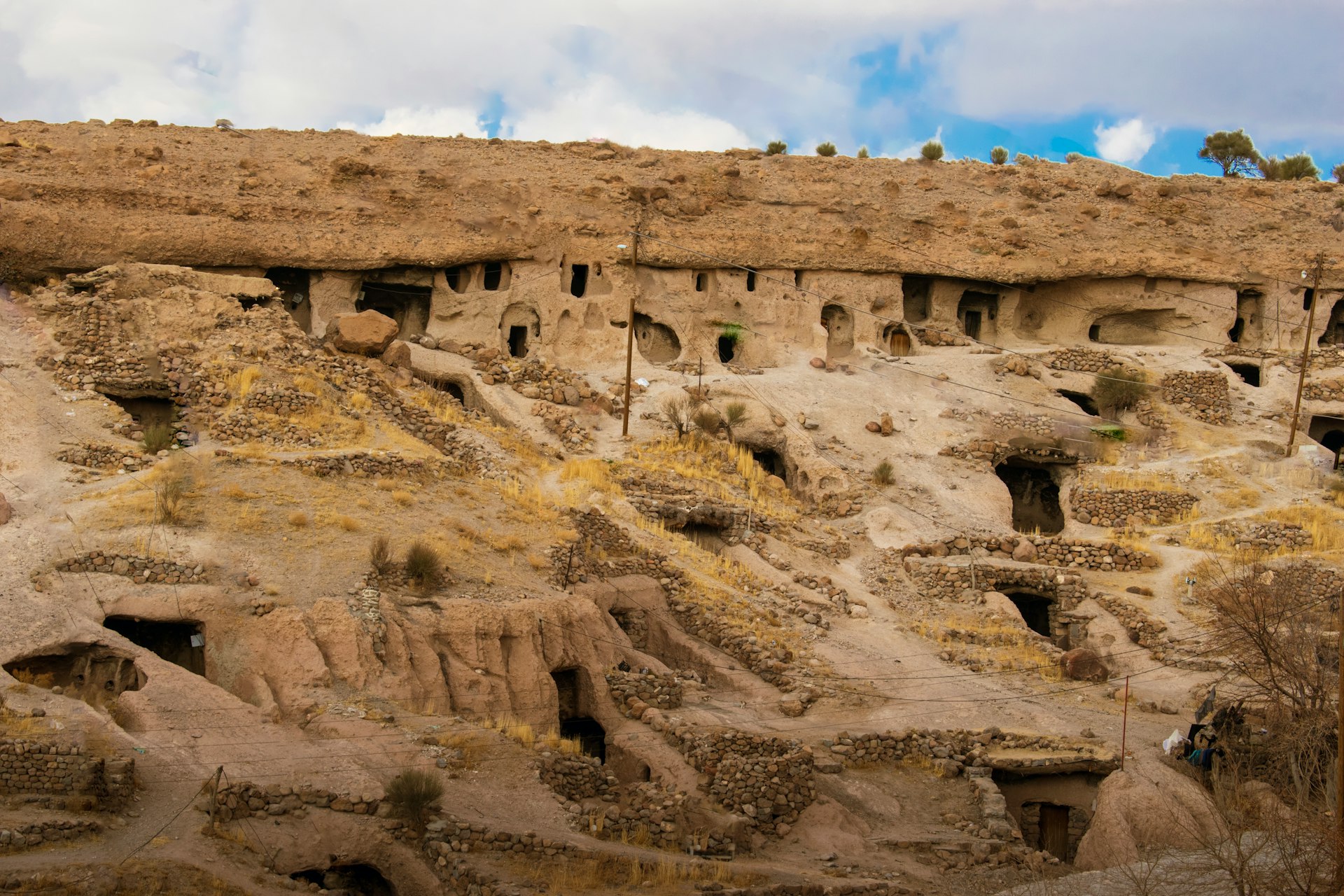 A group of rocks that have been carved into the side of a mountain