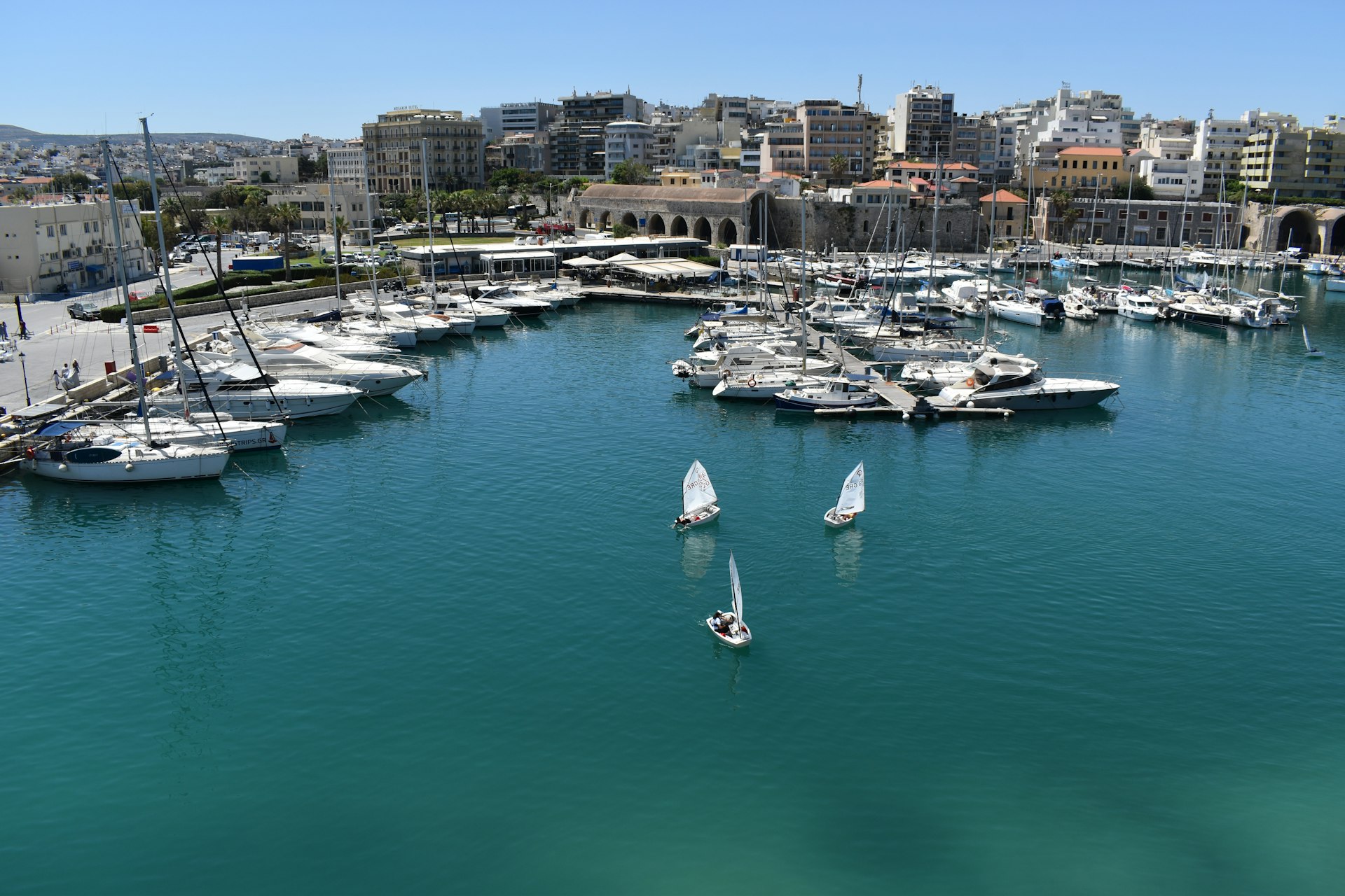 a marina filled with lots of white boats