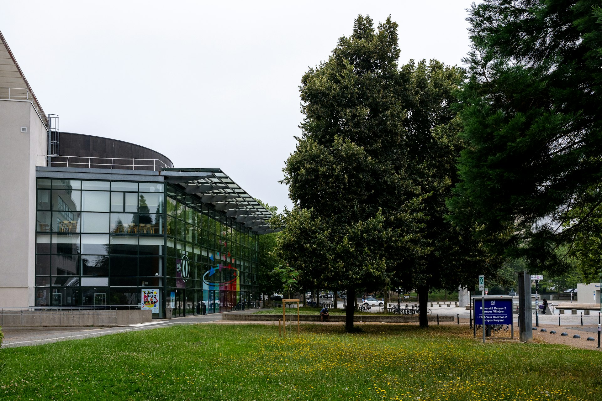 A grassy area with a building in the background