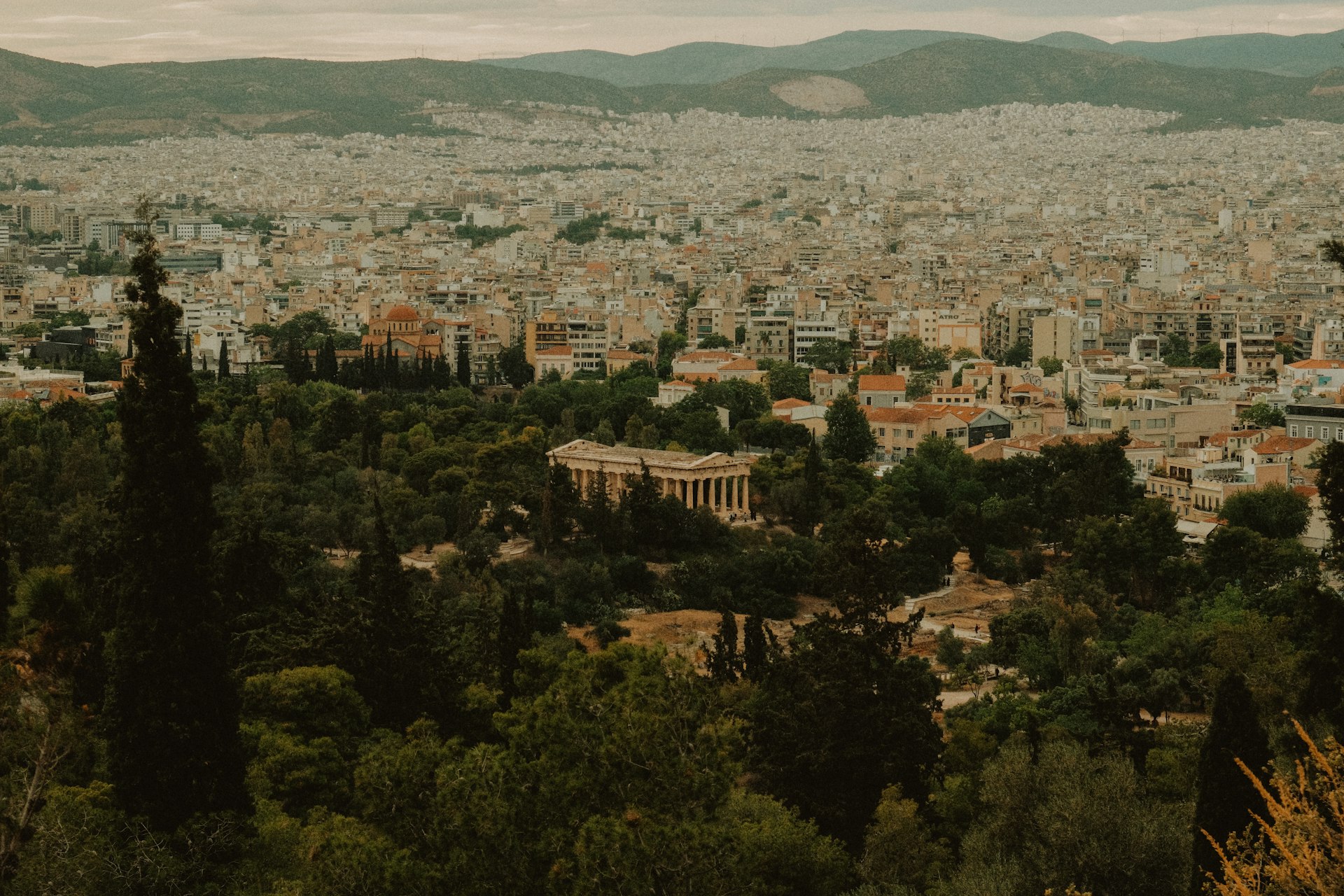a view of a city with mountains in the background