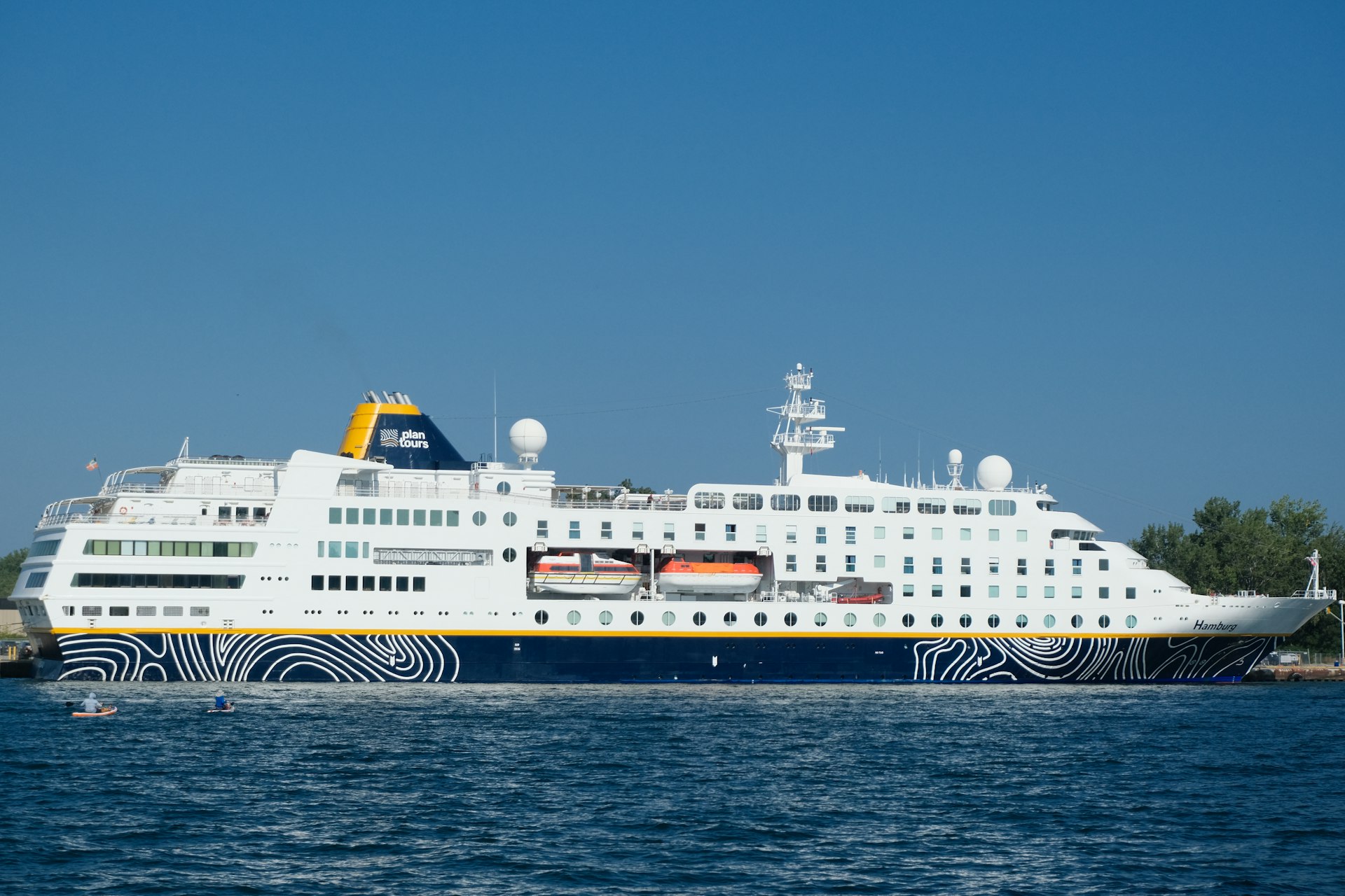 A large cruise ship in a body of water