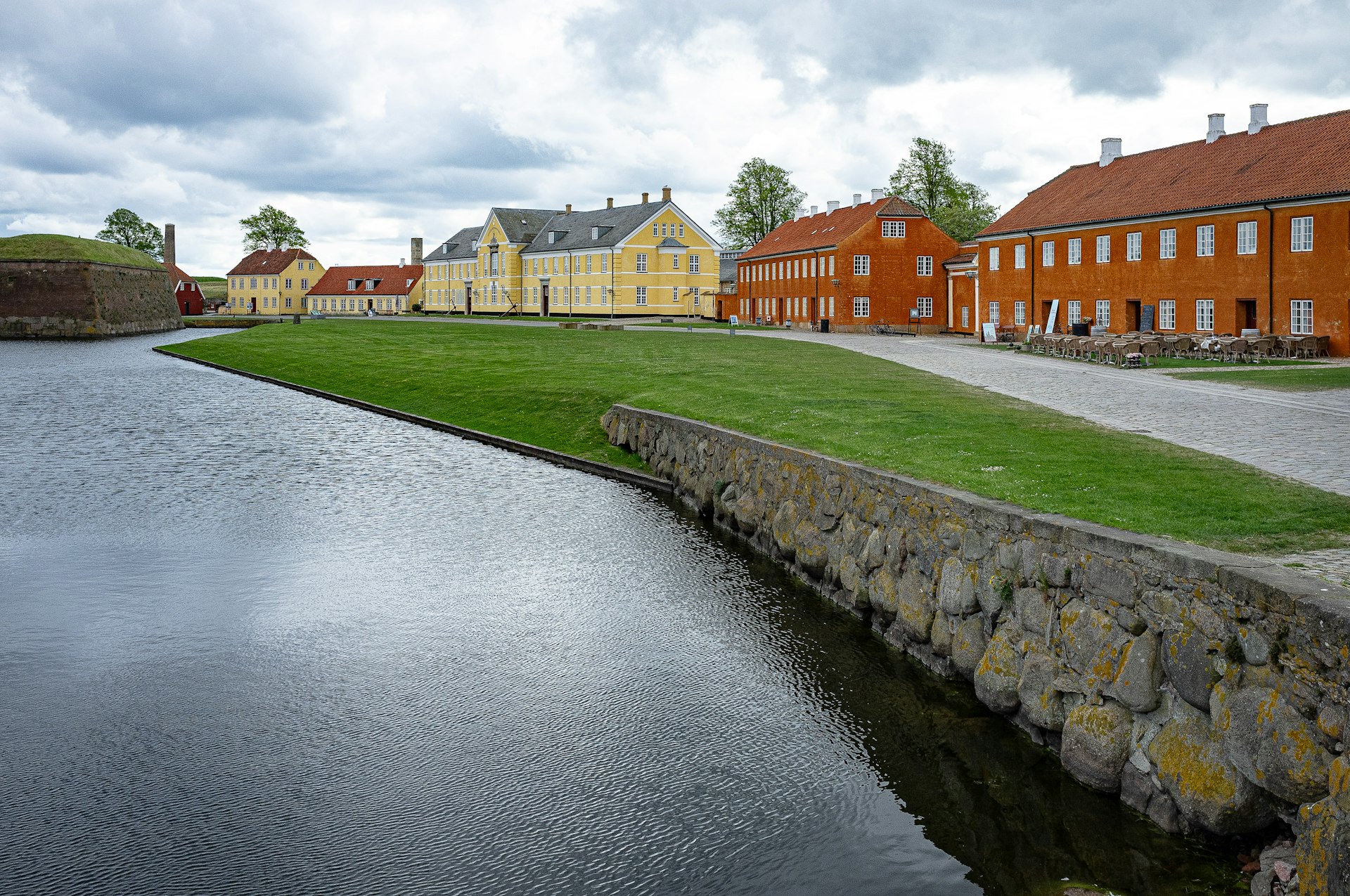 a row of houses next to a body of water