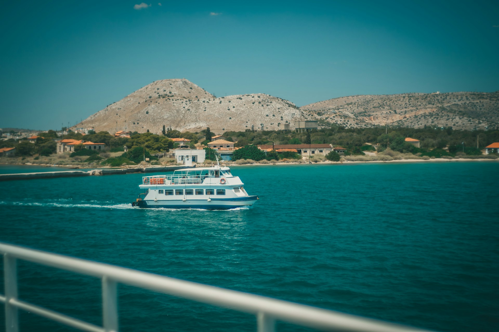 white boat on sea during daytime