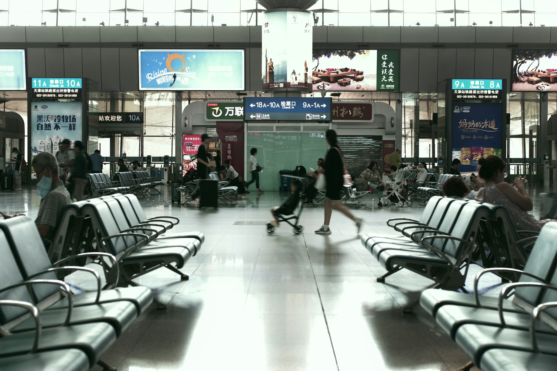 A group of people walking through an airport