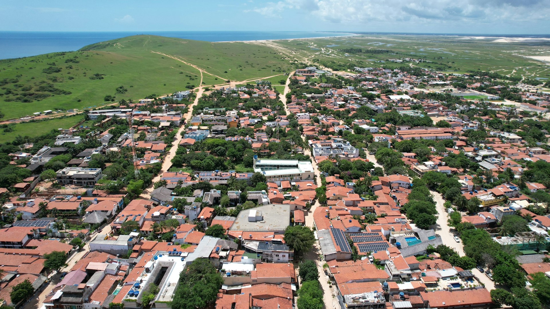 an aerial view of a small town in the middle of the ocean