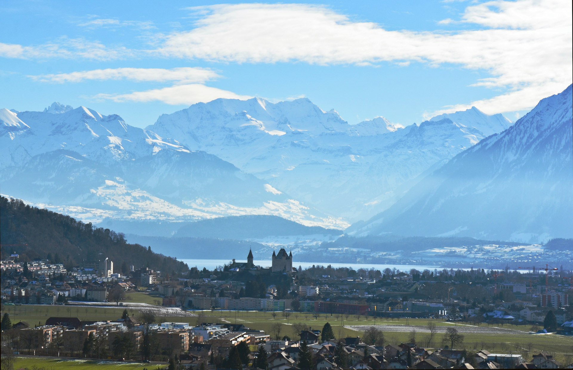 a city in front of mountains