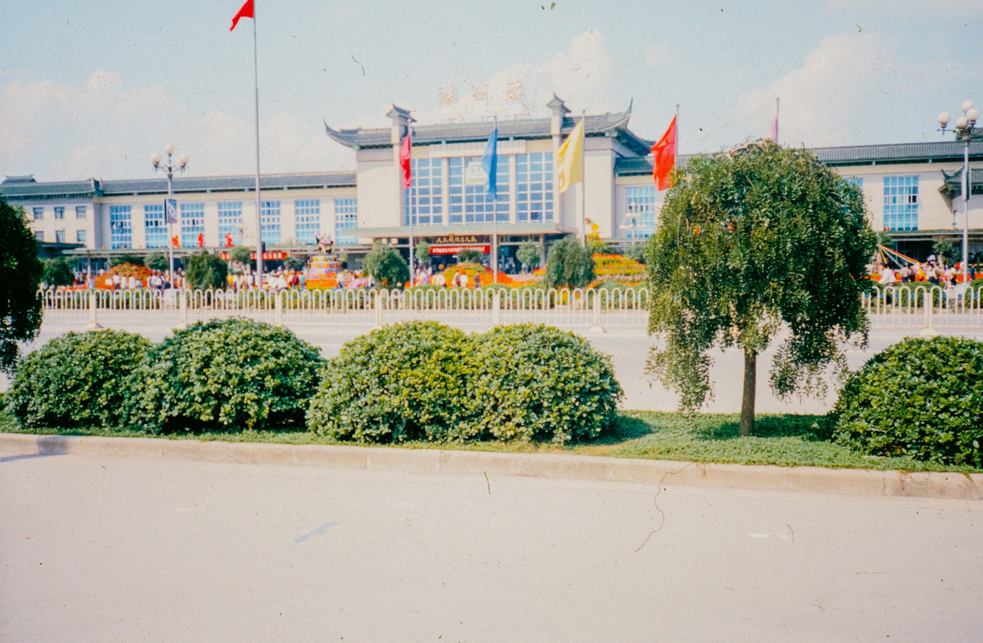 A large building with a lot of flags in front of it