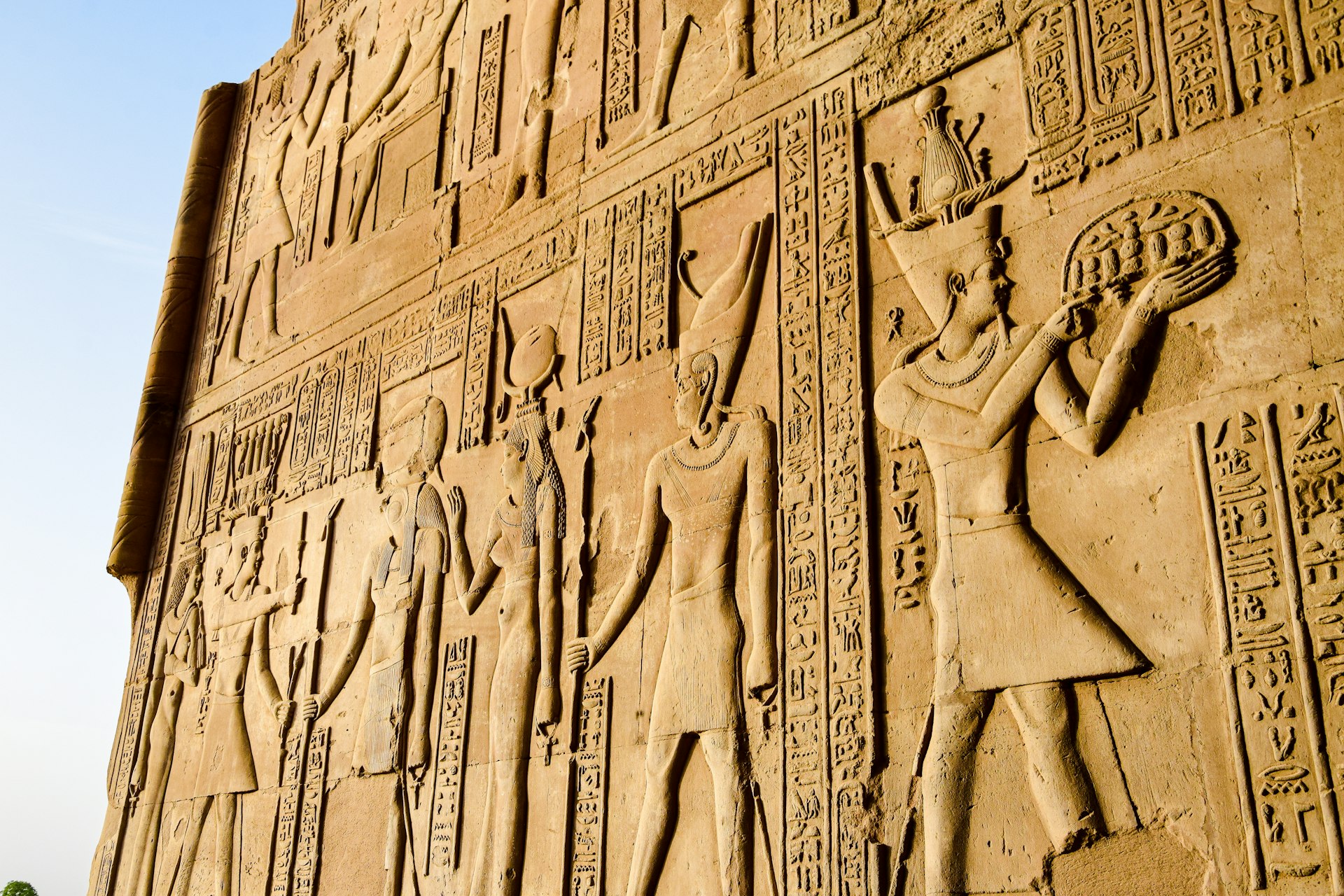 a large wall with a bunch of egyptian art on it