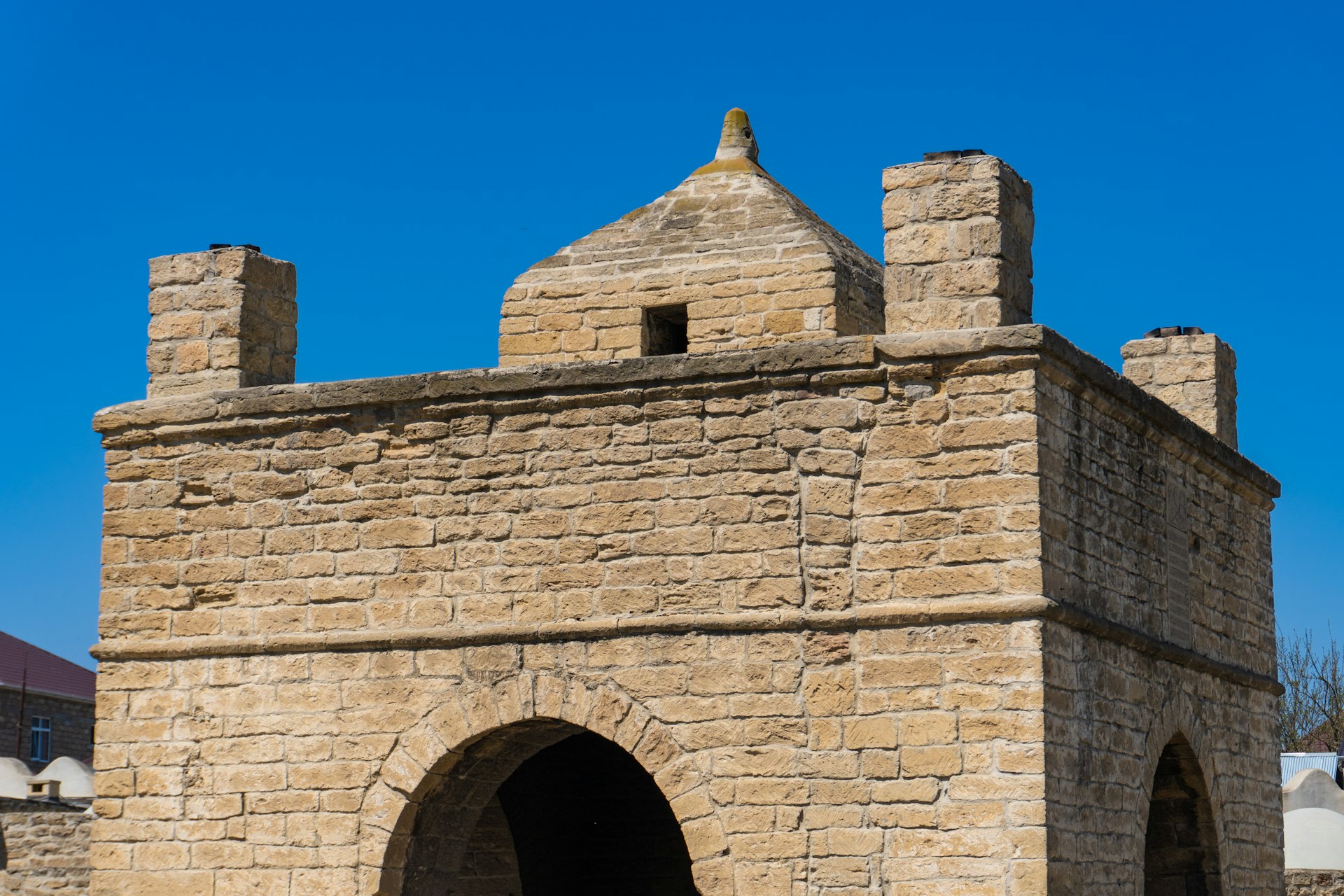 Stone structure with an arched entrance.