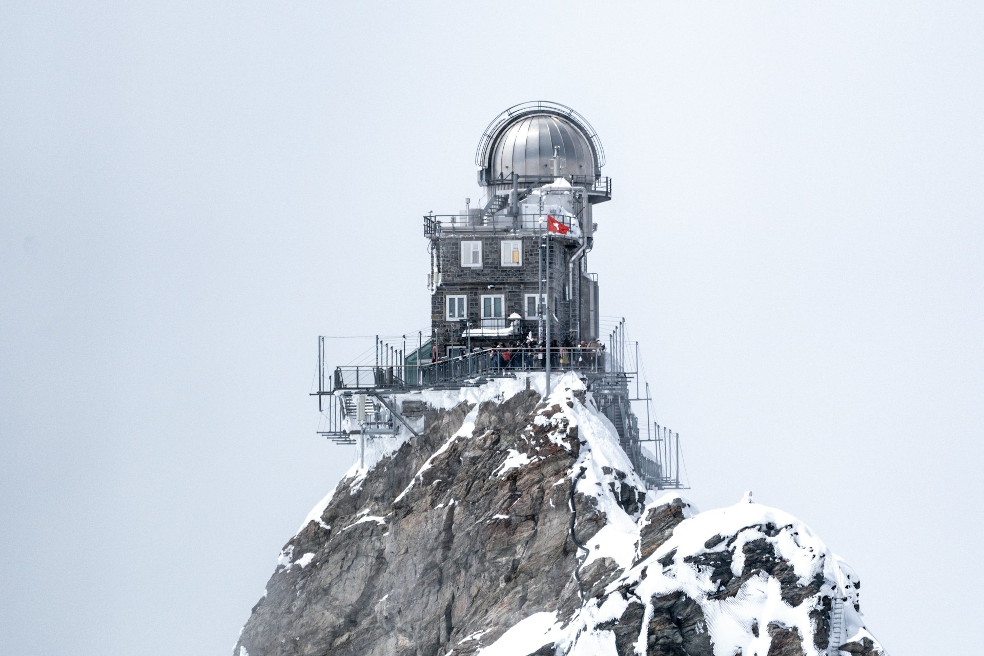 A building on top of a mountain covered in snow