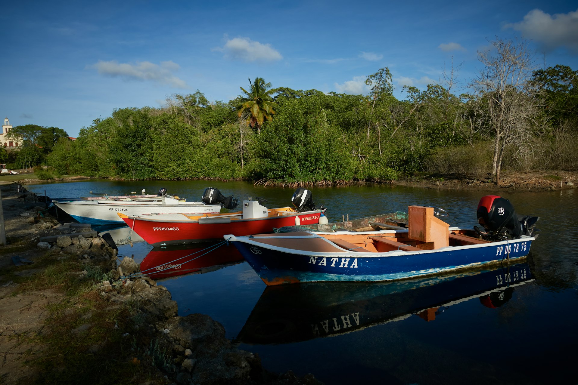 a couple of boats that are sitting in the water