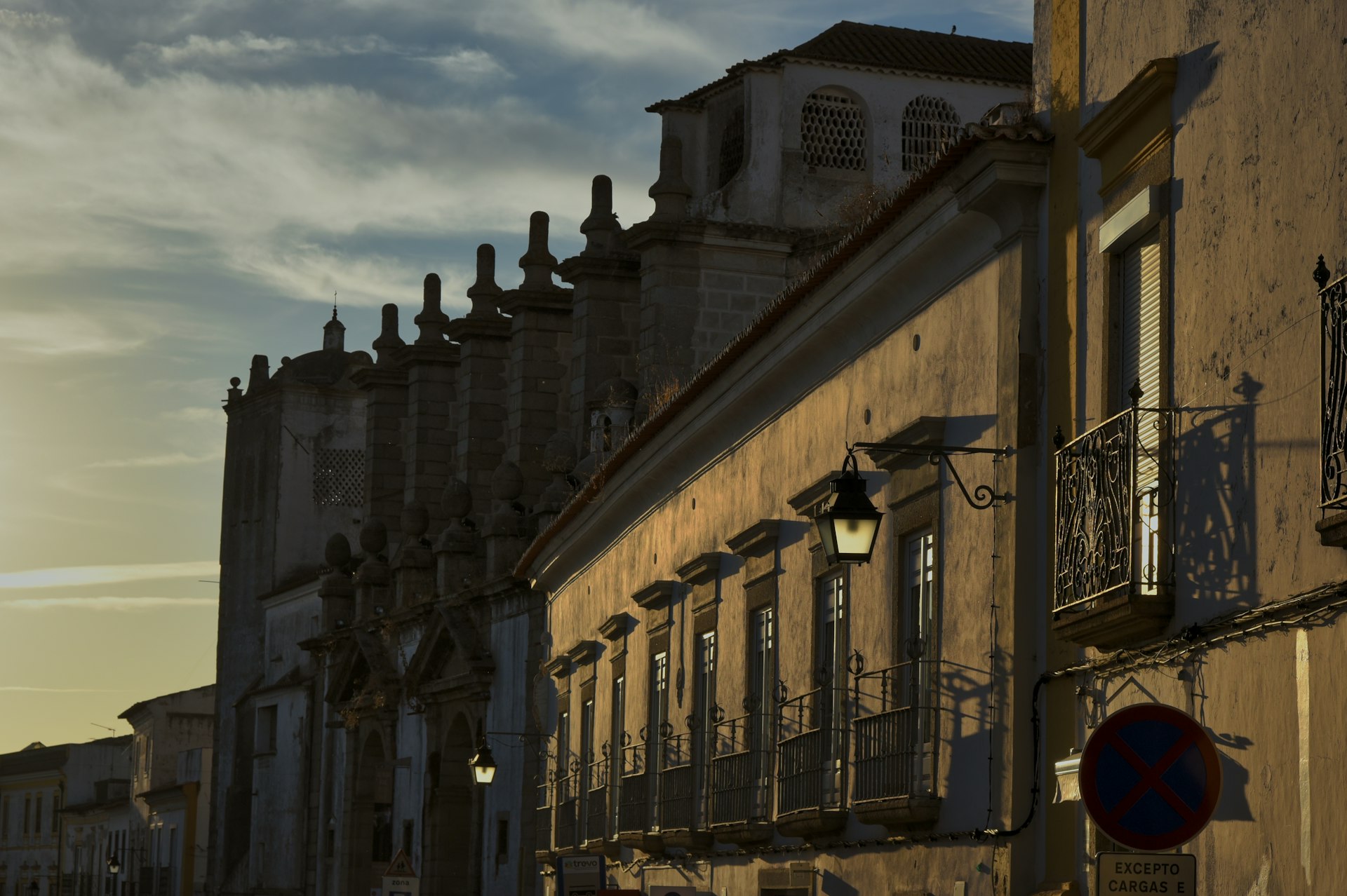 A city street with a clock tower in the background