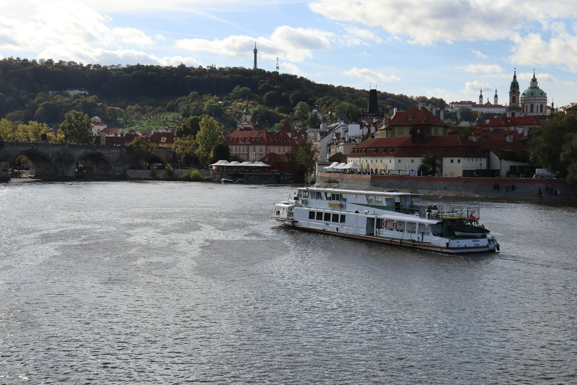 A large boat floating on top of a river