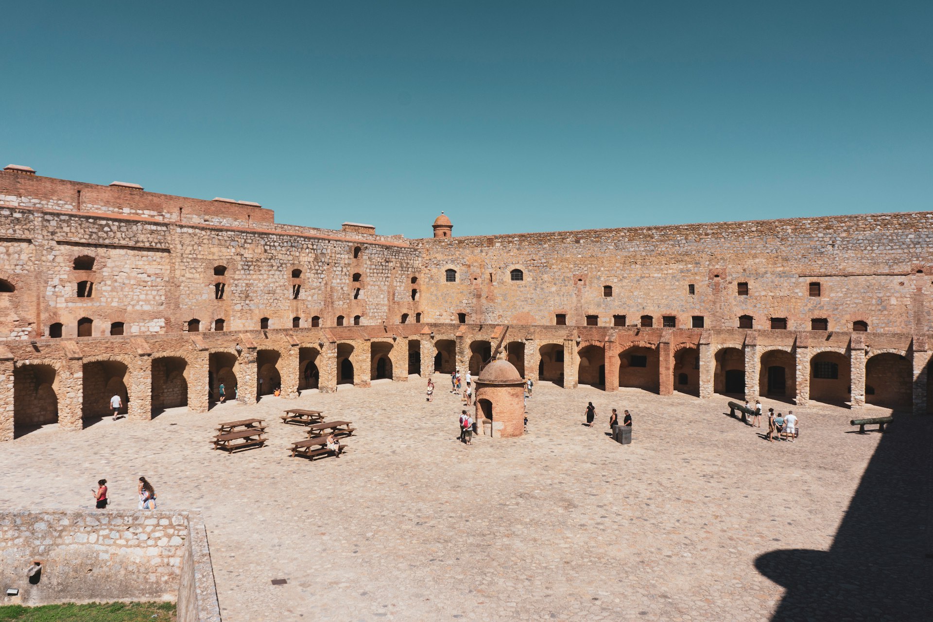 a group of people standing around a courtyard