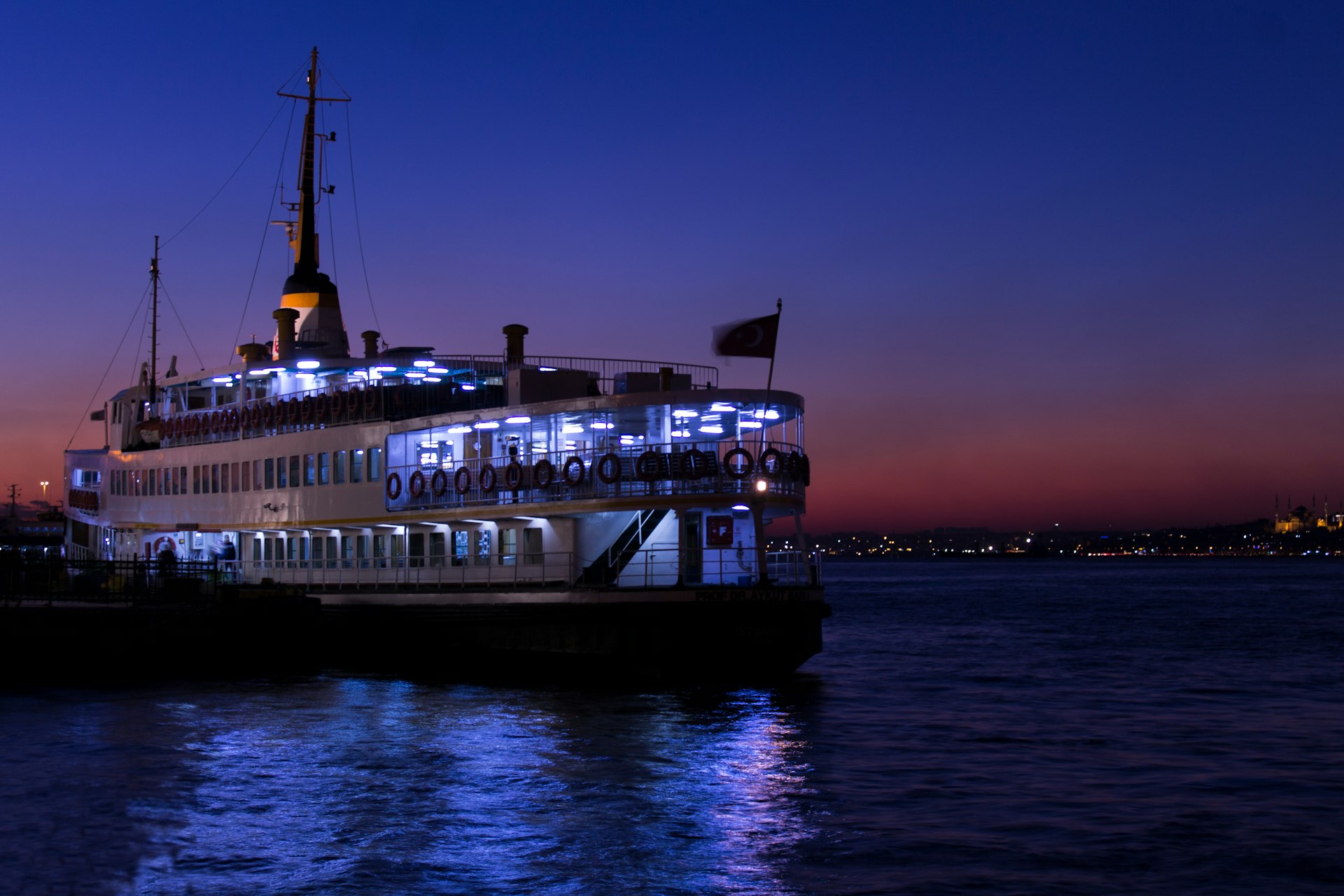 white and black ship on body of water