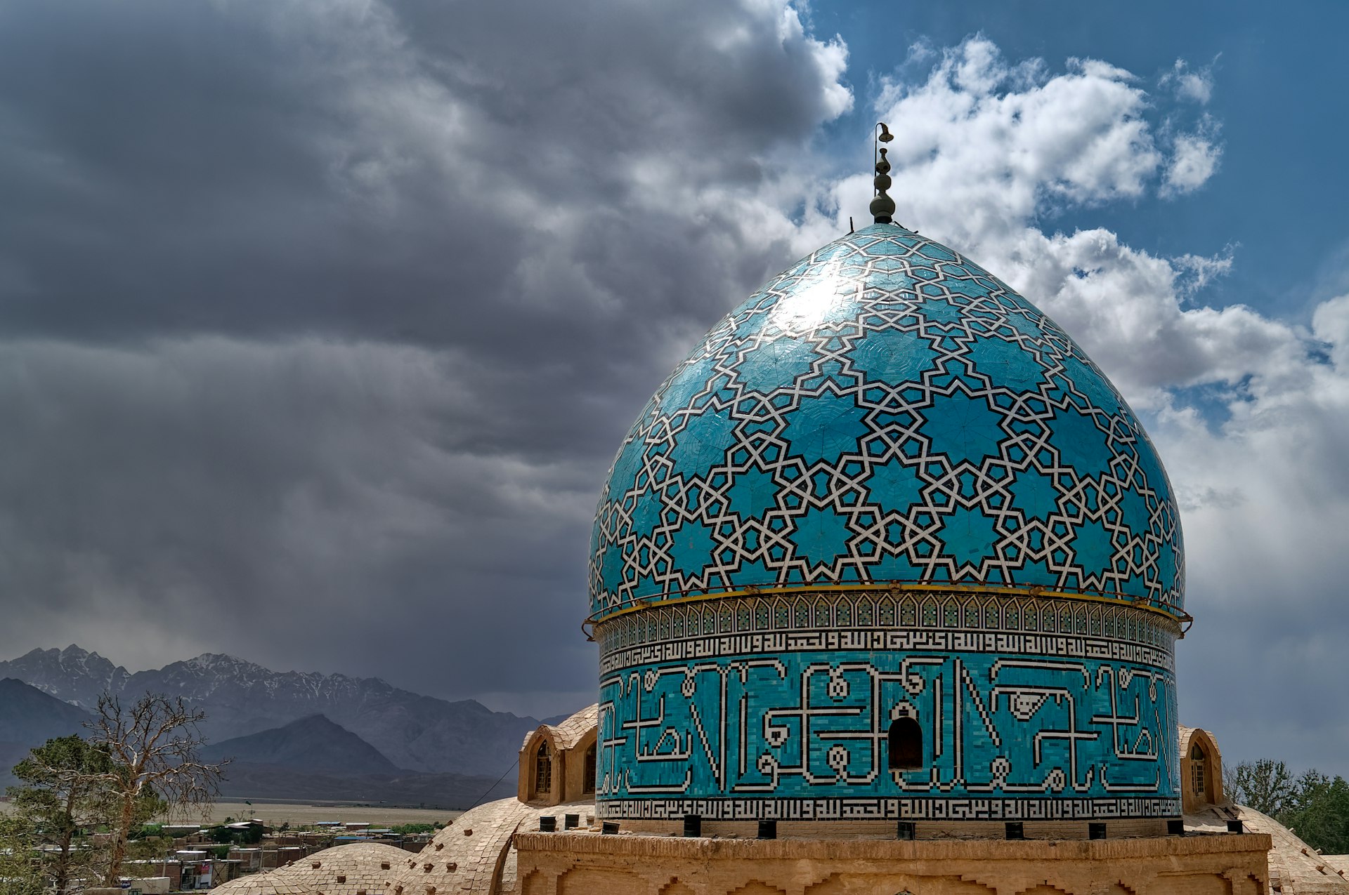 green and white dome building under cloudy sky during daytime